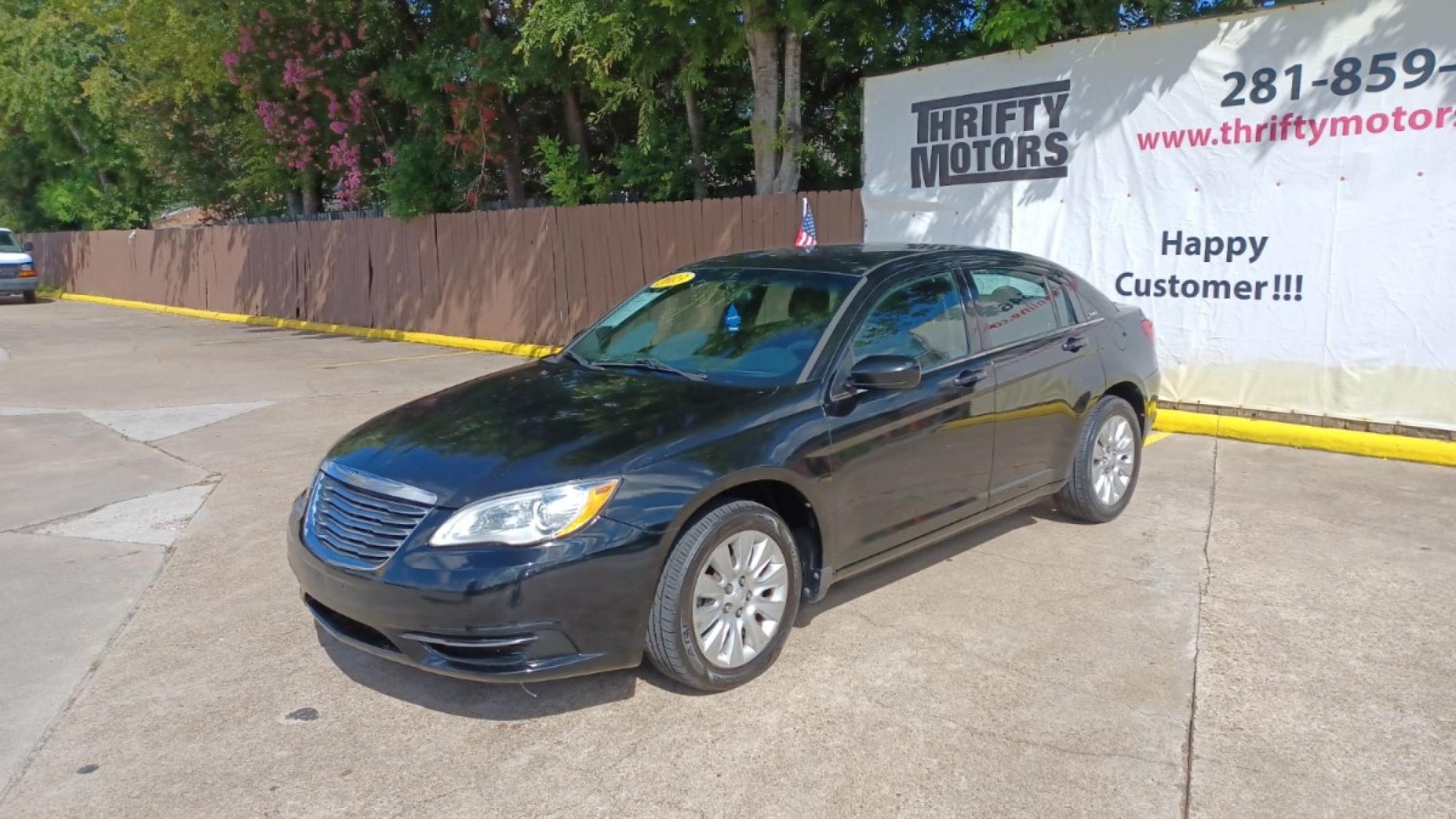 2013 Black Chrysler 200 LX (1C3CCBAB2DN) with an 2.4L L4 DOHC 16V engine, 6-Speed Automatic transmission, located at 16710 Clay Rd., Houston, TX, 77084, (281) 859-7900, 29.834864, -95.656166 - Low Down. Low Payments. - Photo #2
