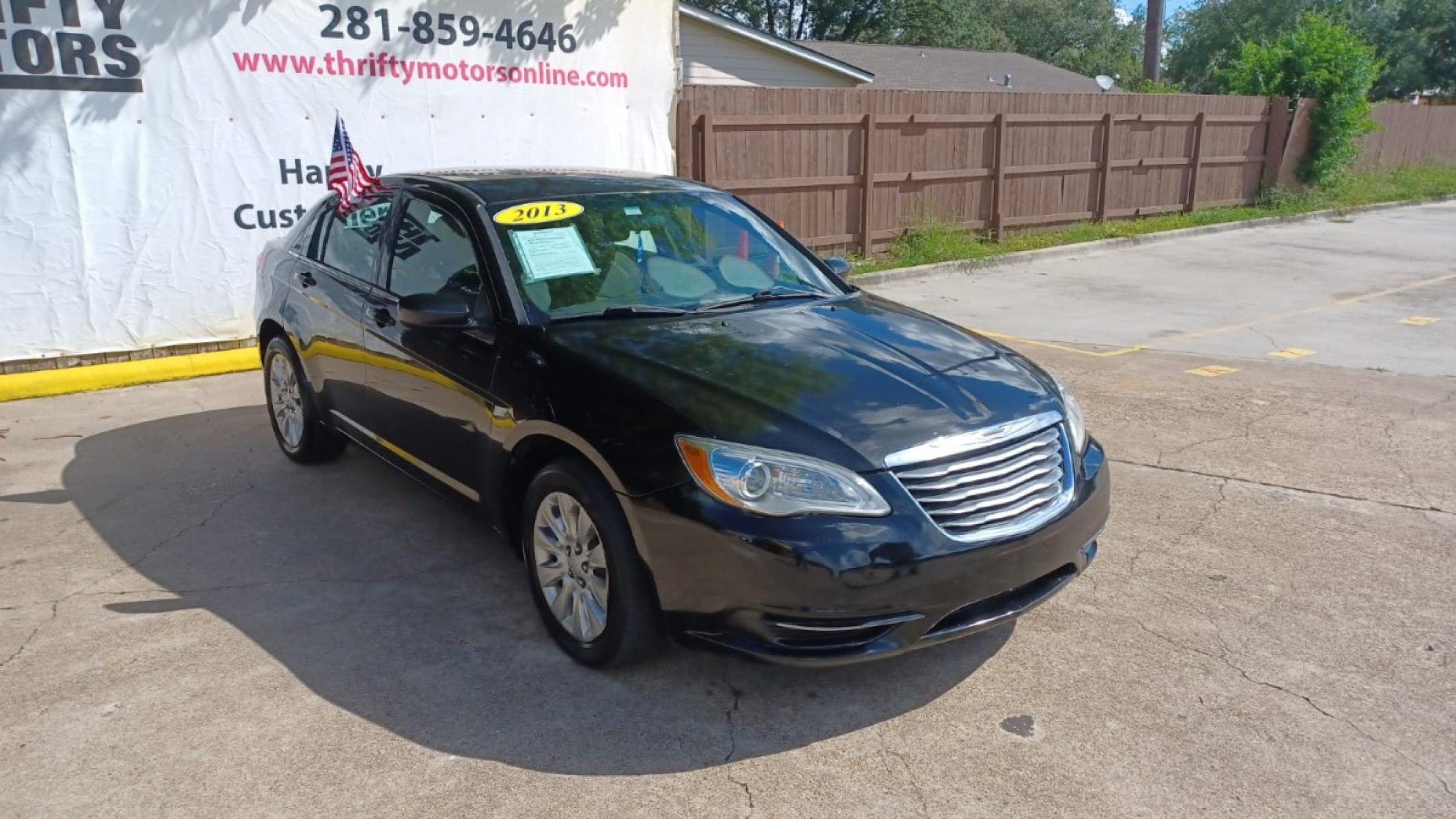 2013 Black Chrysler 200 LX (1C3CCBAB2DN) with an 2.4L L4 DOHC 16V engine, 6-Speed Automatic transmission, located at 16710 Clay Rd., Houston, TX, 77084, (281) 859-7900, 29.834864, -95.656166 - Low Down. Low Payments. - Photo #3
