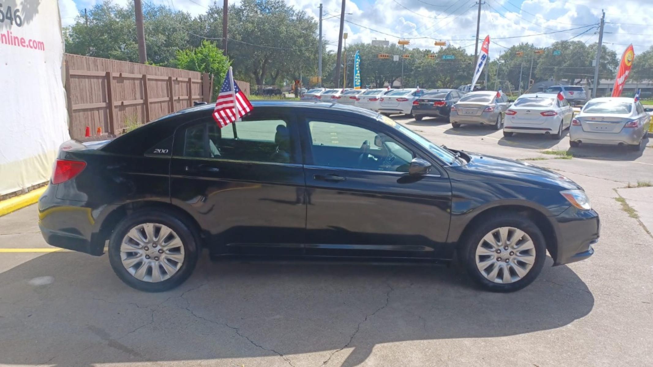 2013 Black Chrysler 200 LX (1C3CCBAB2DN) with an 2.4L L4 DOHC 16V engine, 6-Speed Automatic transmission, located at 16710 Clay Rd., Houston, TX, 77084, (281) 859-7900, 29.834864, -95.656166 - Low Down. Low Payments. - Photo #4
