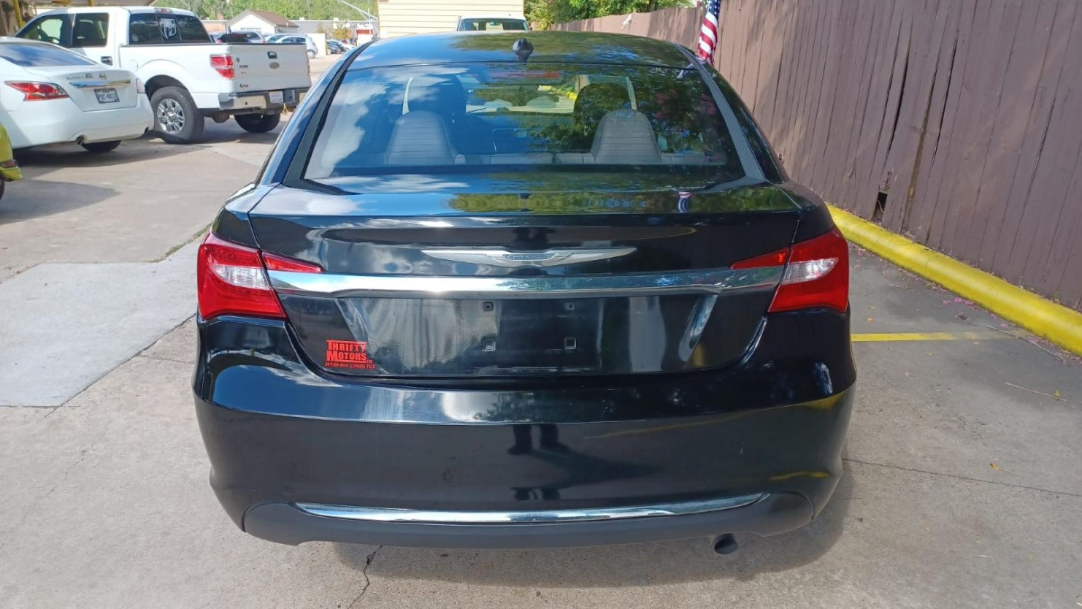 2013 Black Chrysler 200 LX (1C3CCBAB2DN) with an 2.4L L4 DOHC 16V engine, 6-Speed Automatic transmission, located at 16710 Clay Rd., Houston, TX, 77084, (281) 859-7900, 29.834864, -95.656166 - Low Down. Low Payments. - Photo #5