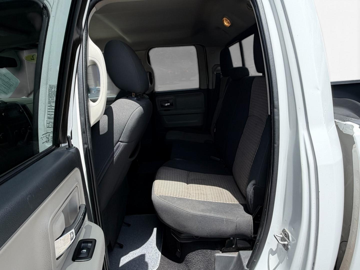 2012 Black Dodge Ram 1500 SLT Quad Cab 4WD (1C6RD7GT0CS) with an 5.7L V8 OHV 16V engine, 5-Speed Automatic transmission, located at 16710 Clay Rd., Houston, TX, 77084, (281) 859-7900, 29.834864, -95.656166 - Low Down. Low Payments- Photo#9