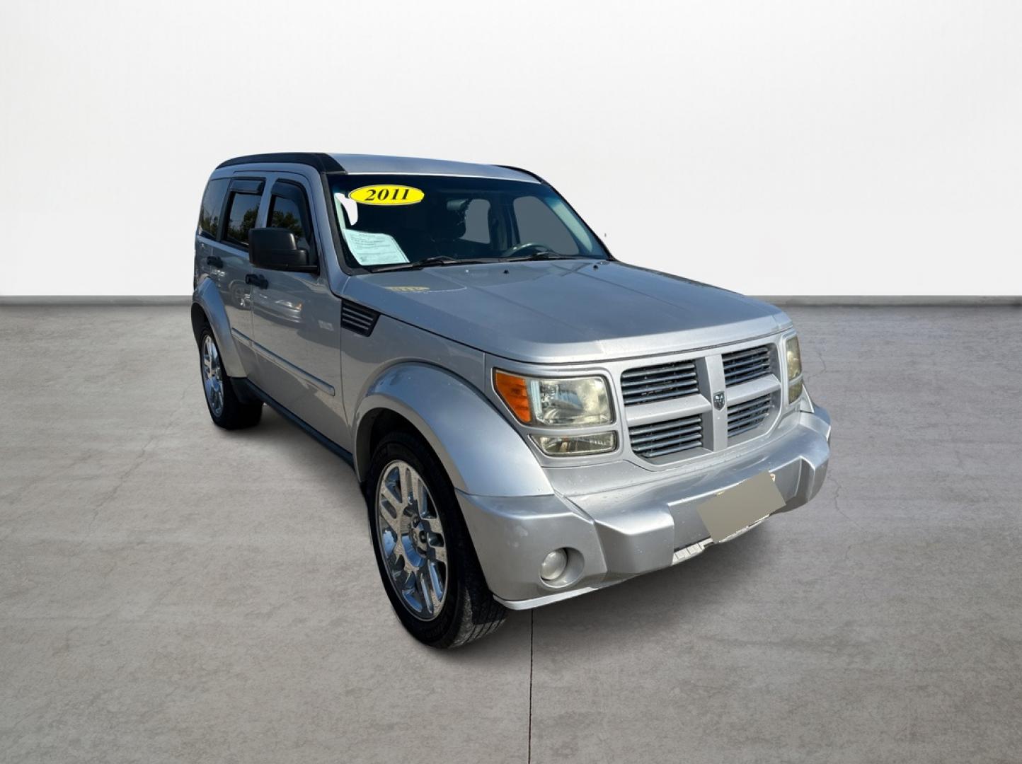 2011 Silver Dodge Nitro Heat 2WD (1D4PT4GK0BW) with an 3.7L V6 SOHC 12V engine, 4-Speed Automatic transmission, located at 16710 Clay Rd., Houston, TX, 77084, (281) 859-7900, 29.834864, -95.656166 - Low Down. Low Payments. - Photo#2