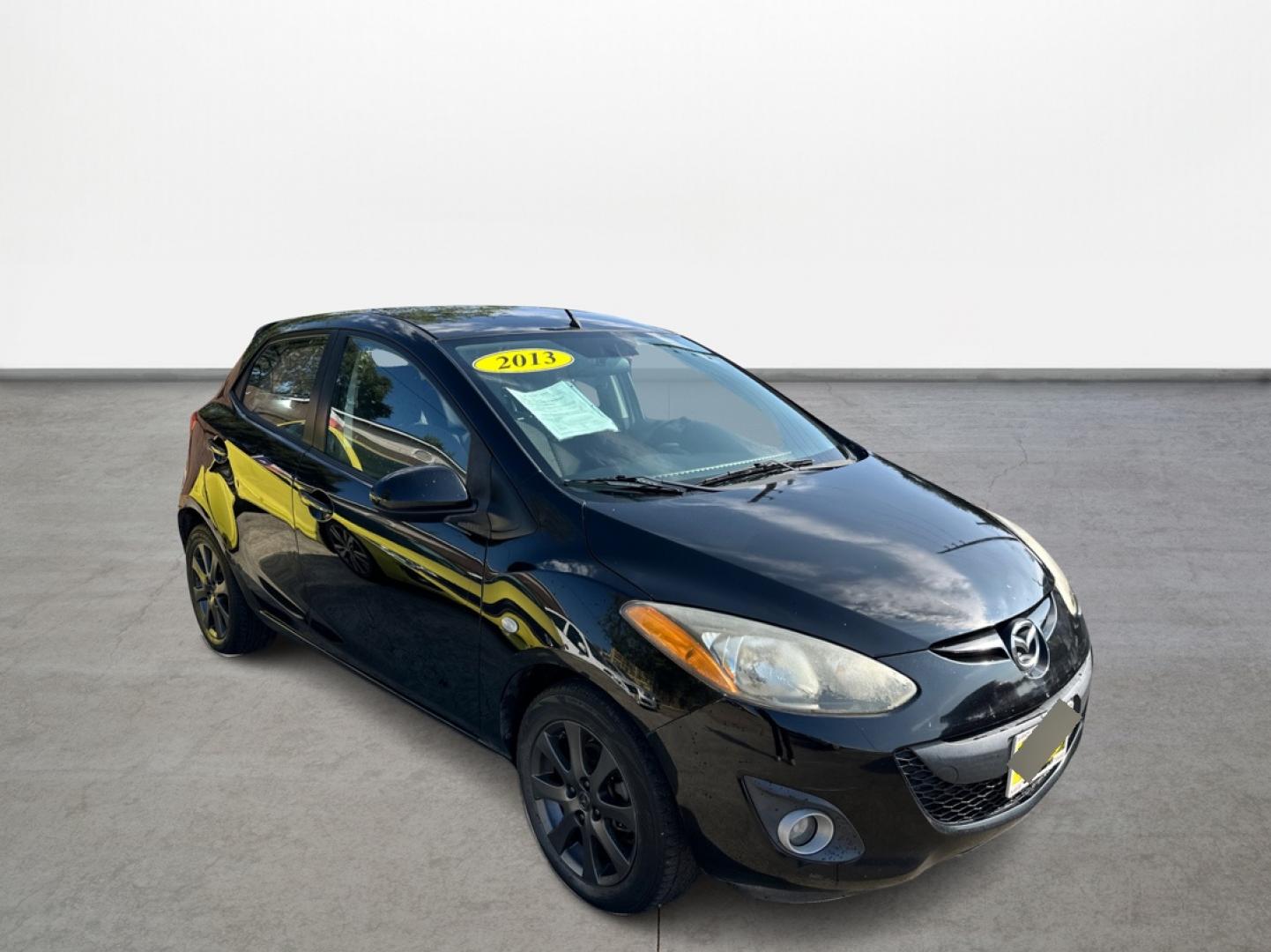 2013 BLACK Mazda MAZDA2 Touring (JM1DE1LY7D0) with an 1.5L L4 DOHC 16V engine, located at 16710 Clay Rd., Houston, TX, 77084, (281) 859-7900, 29.834864, -95.656166 - Photo#2