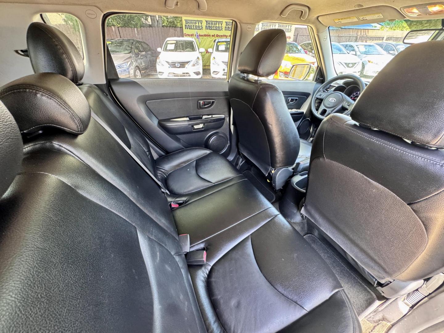 2012 Green /Gray Kia Soul Base (KNDJT2A53C7) with an 1.6L L4 DOHC 16V engine, 5-Speed Automatic transmission, located at 16710 Clay Rd., Houston, TX, 77084, (281) 859-7900, 29.834864, -95.656166 - Low Down. Low Payments. - Photo#11