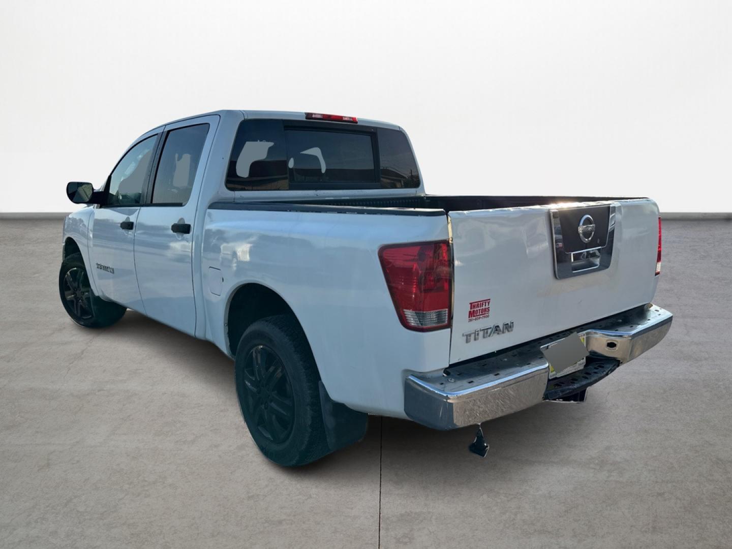 2008 White /Gray Nissan Titan (1N6BA07D48N) with an 5.6L V8 5.6L V8 engine, Automatic 5-Speed transmission, located at 16710 Clay Rd., Houston, TX, 77084, (281) 859-7900, 29.834864, -95.656166 - Low Down. Low Payments. - Photo#6