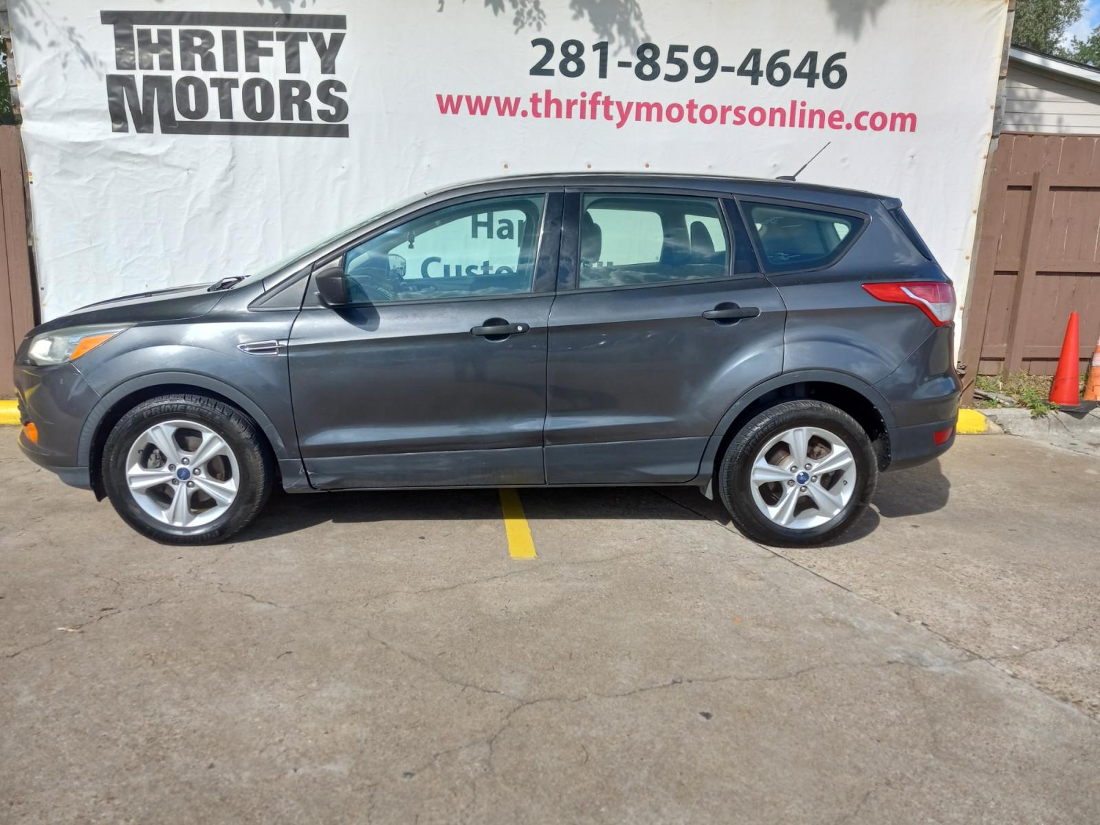 2015 Gray Ford Escape S FWD (1FMCU0F77FU) with an 2.5L L4 DOHC 16V engine, 6-Speed Automatic transmission, located at 16710 Clay Rd., Houston, TX, 77084, (281) 859-7900, 29.834864, -95.656166 - Low Down. Low Payments. - Photo #0