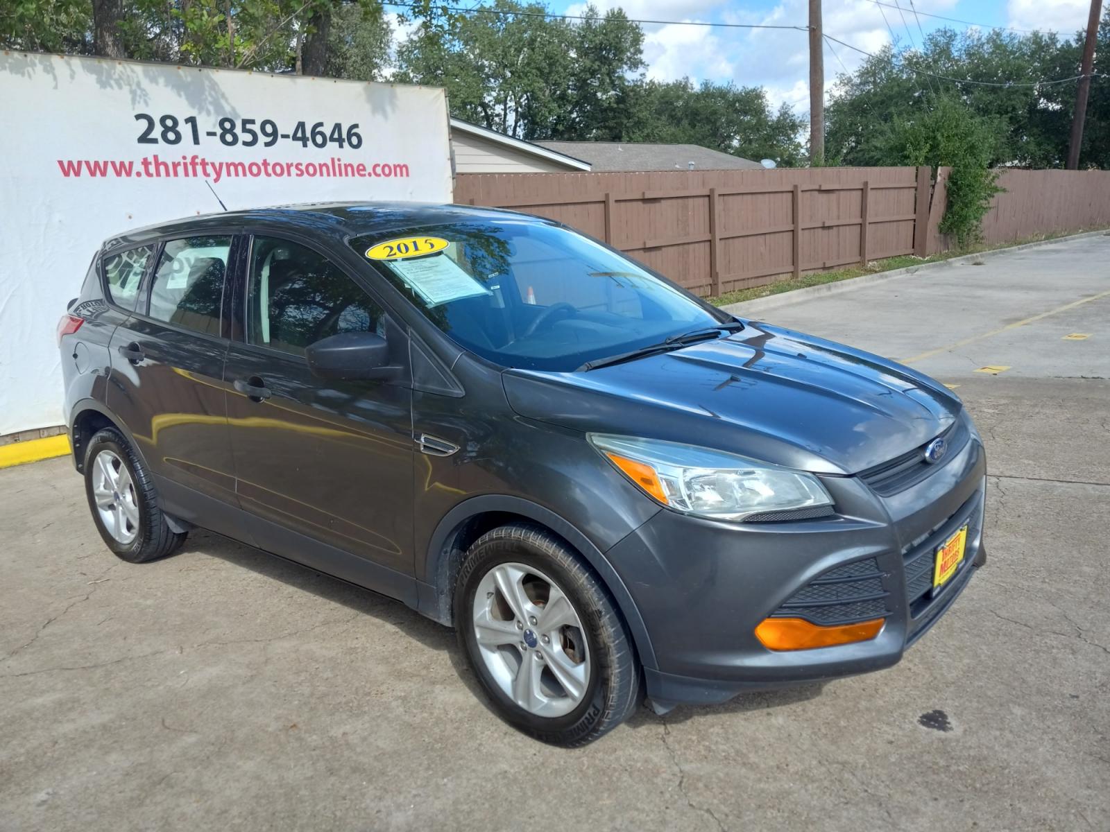 2015 Gray Ford Escape S FWD (1FMCU0F77FU) with an 2.5L L4 DOHC 16V engine, 6-Speed Automatic transmission, located at 16710 Clay Rd., Houston, TX, 77084, (281) 859-7900, 29.834864, -95.656166 - Low Down. Low Payments. - Photo #4