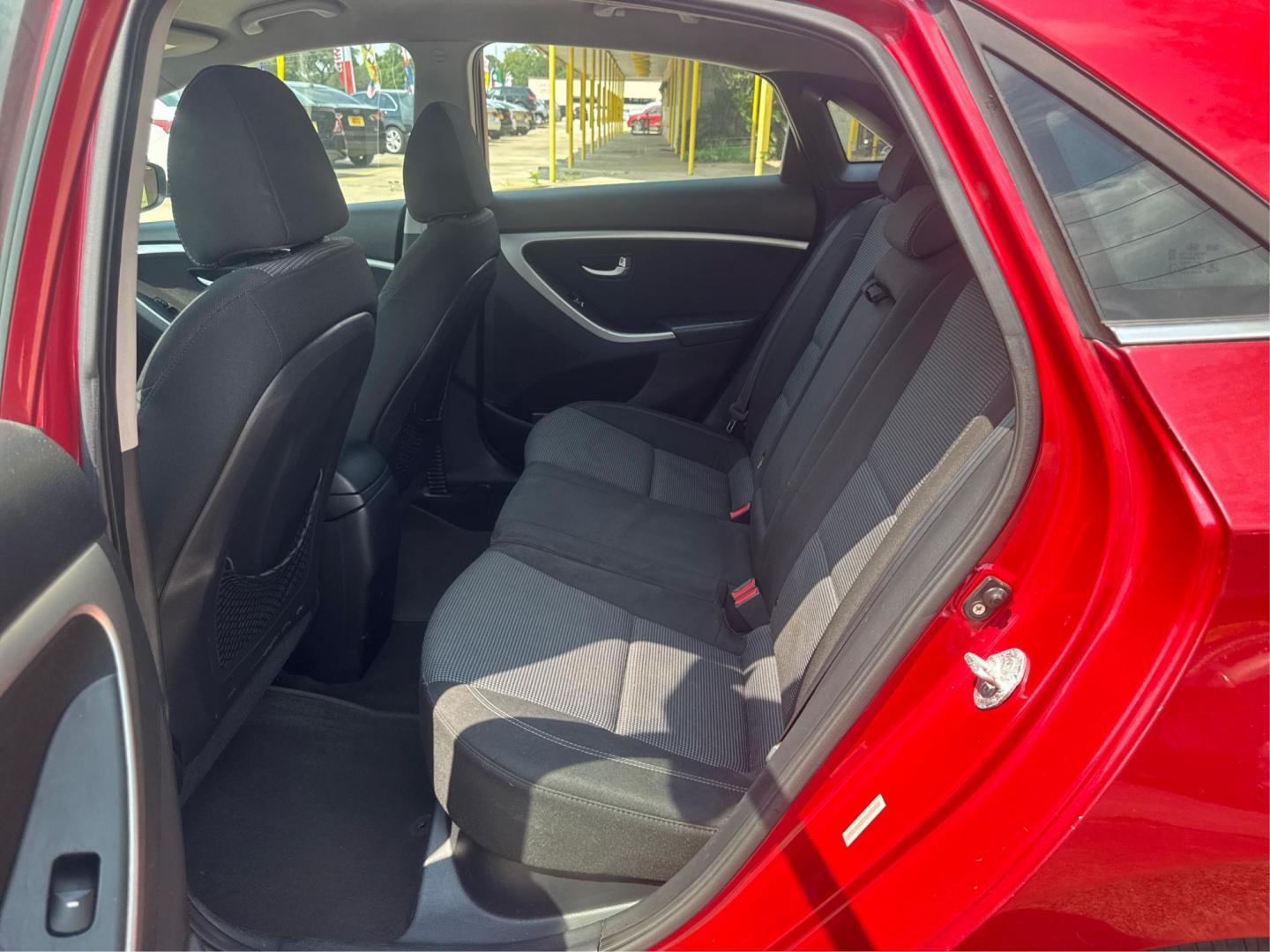 2014 Red Hyundai Elantra GT A/T (KMHD35LH7EU) with an 2.0L L4 16V DOHC engine, 6-Speed Automatic transmission, located at 16710 Clay Rd., Houston, TX, 77084, (281) 859-7900, 29.834864, -95.656166 - Low Down. Low Payments. - Photo#9