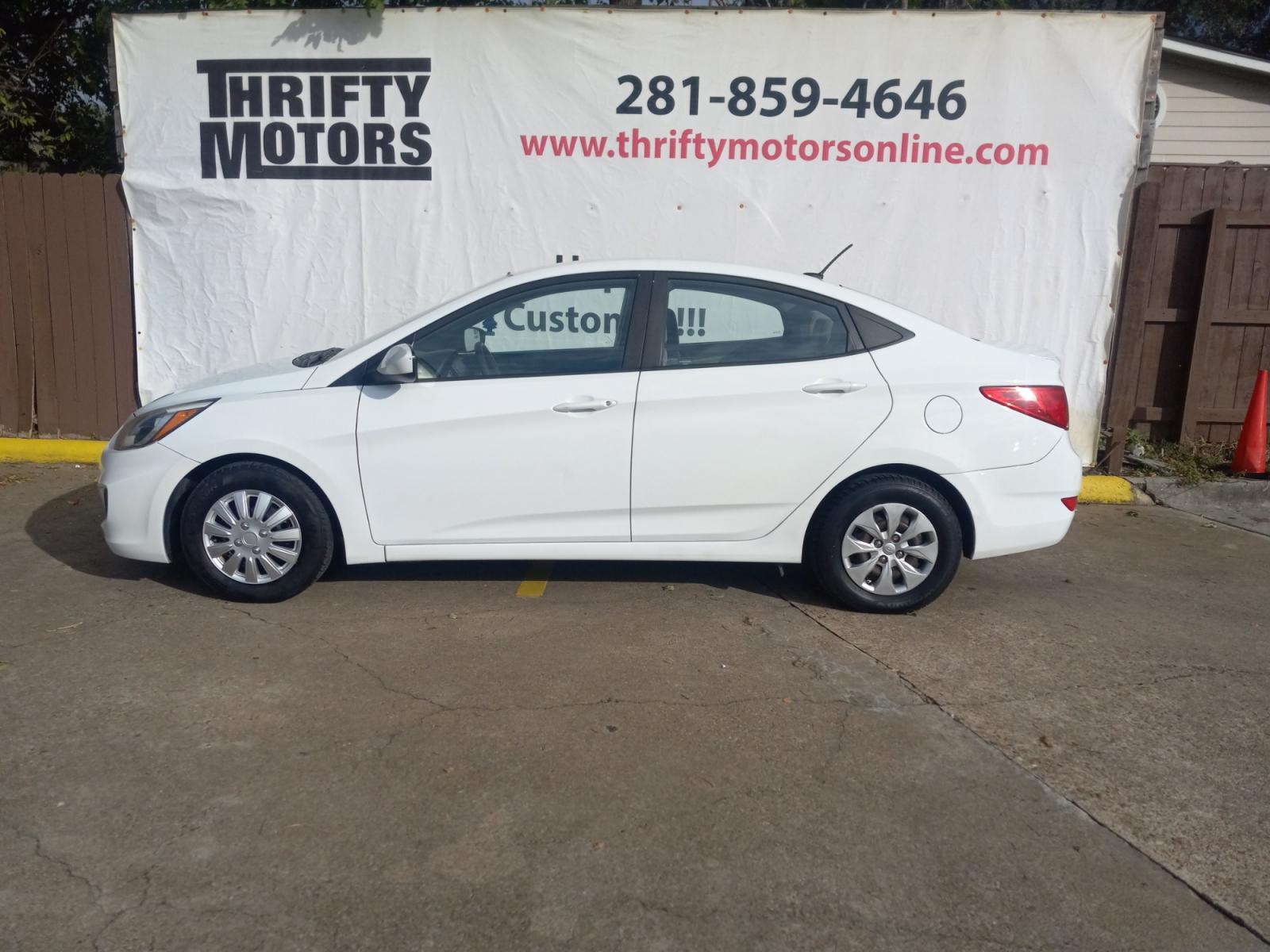 2017 White Hyundai Accent SE 4-Door 6M (KMHCT4AE5HU) with an 1.6L L4 DOHC 16V engine, 6M transmission, located at 16710 Clay Rd., Houston, TX, 77084, (281) 859-7900, 29.834864, -95.656166 - Low Down. Low Payments. - Photo #0
