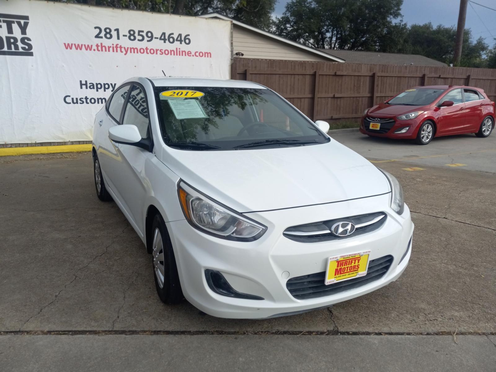 2017 White Hyundai Accent SE 4-Door 6M (KMHCT4AE5HU) with an 1.6L L4 DOHC 16V engine, 6M transmission, located at 16710 Clay Rd., Houston, TX, 77084, (281) 859-7900, 29.834864, -95.656166 - Low Down. Low Payments. - Photo #3