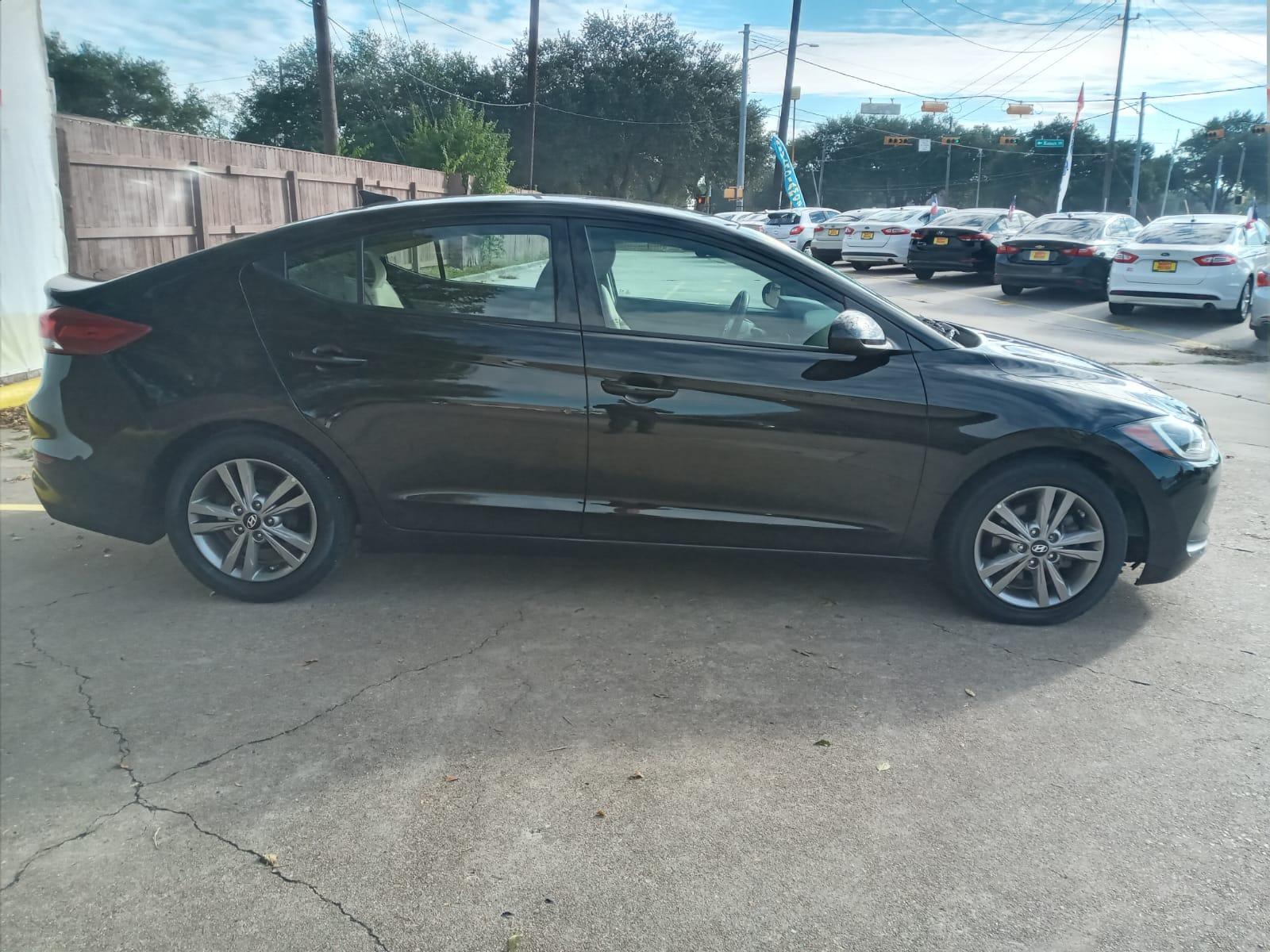 2017 BLACK Hyundai Elantra Limited (5NPD84LF4HH) with an 1.8L L4 DOHC 16V engine, 6A transmission, located at 16710 Clay Rd., Houston, TX, 77084, (281) 859-7900, 29.834864, -95.656166 - Low Down. Low Payments. - Photo #4