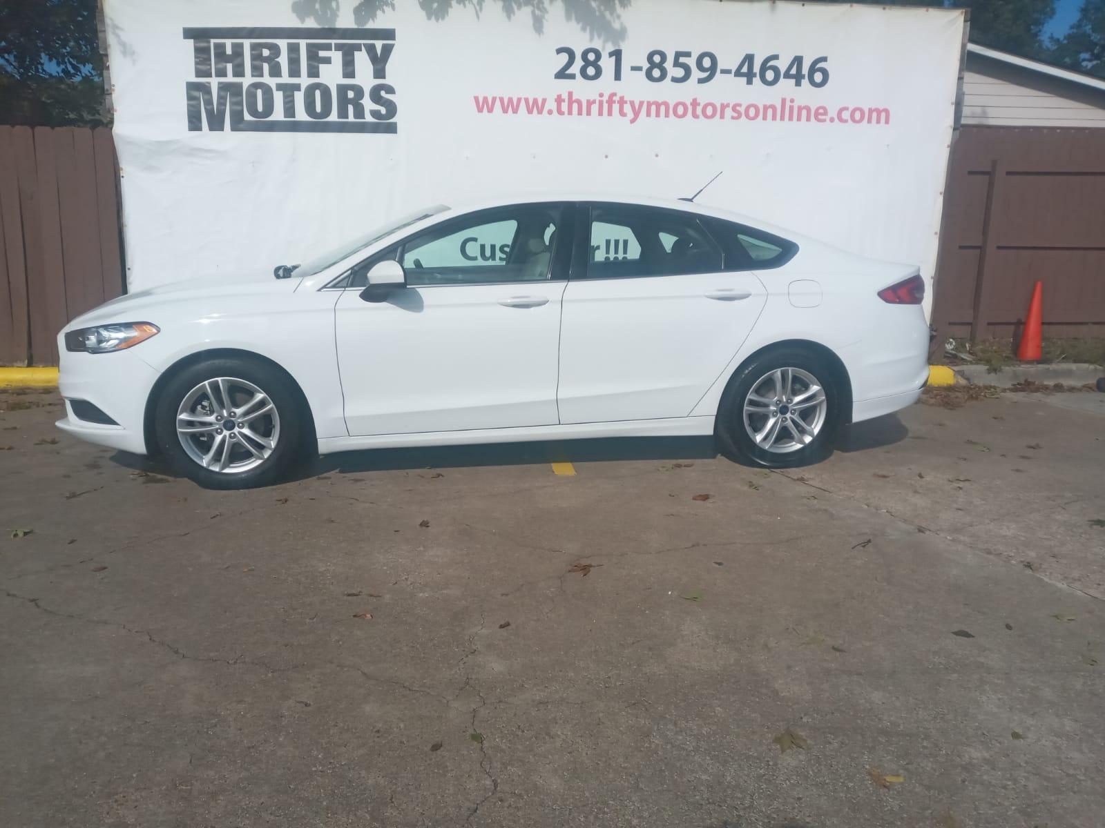 2018 White Ford Fusion SE (3FA6P0H79JR) with an 2.5L L4 DOHC 16V engine, 6A transmission, located at 16710 Clay Rd., Houston, TX, 77084, (281) 859-7900, 29.834864, -95.656166 - Low Down. Low Payments. - Photo #0