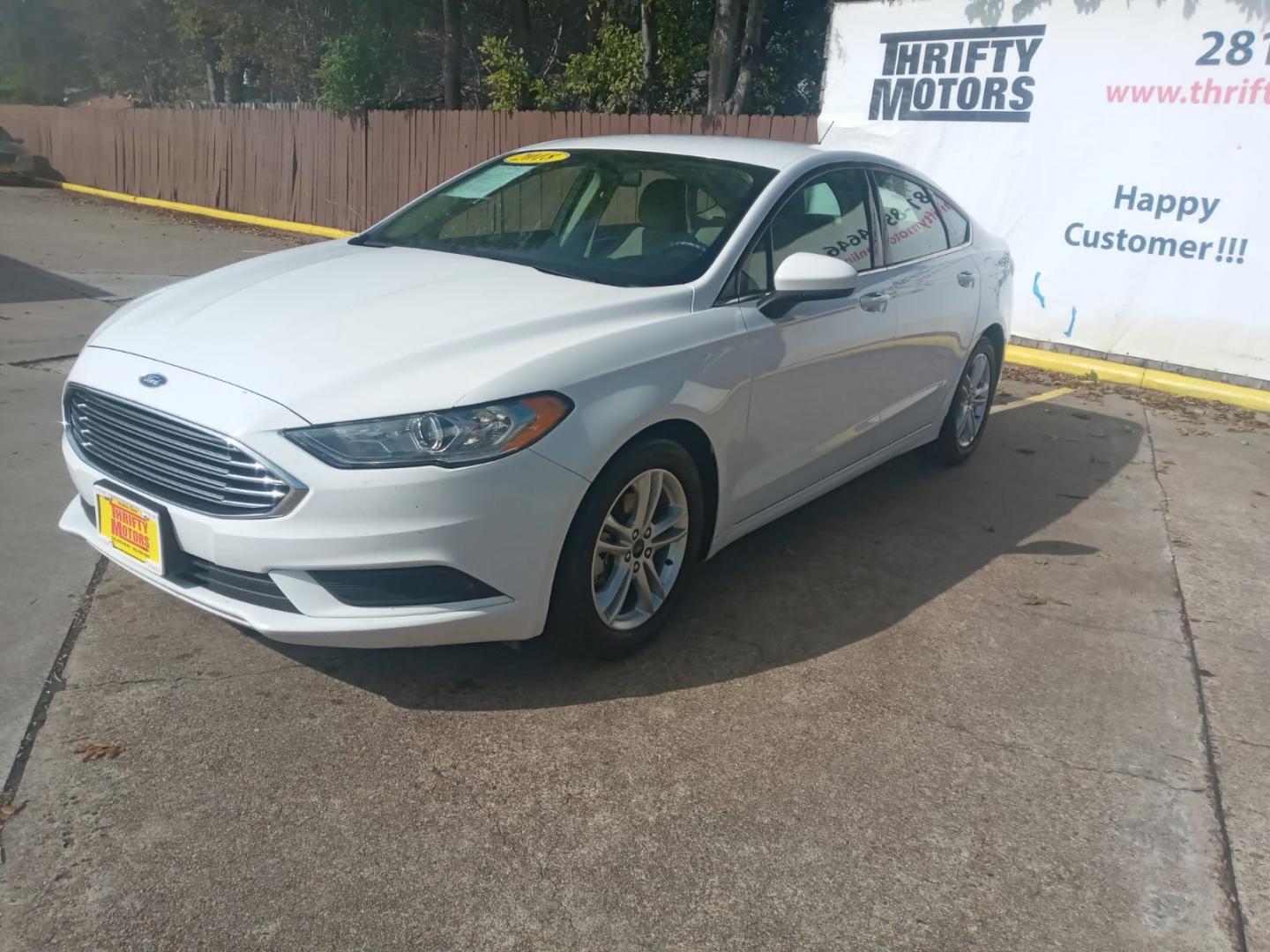 2018 White Ford Fusion SE (3FA6P0H79JR) with an 2.5L L4 DOHC 16V engine, 6A transmission, located at 16710 Clay Rd., Houston, TX, 77084, (281) 859-7900, 29.834864, -95.656166 - Low Down. Low Payments. - Photo#2