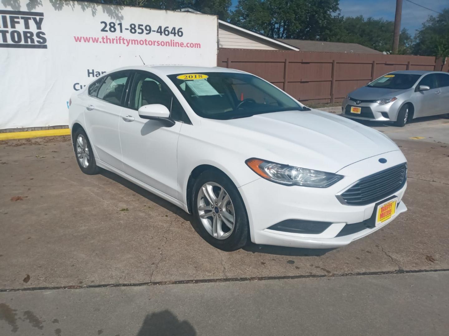 2018 White Ford Fusion SE (3FA6P0H79JR) with an 2.5L L4 DOHC 16V engine, 6A transmission, located at 16710 Clay Rd., Houston, TX, 77084, (281) 859-7900, 29.834864, -95.656166 - Low Down. Low Payments. - Photo#3