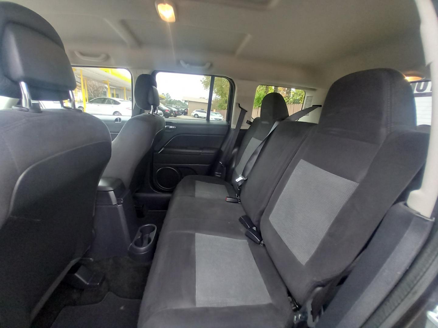 2015 Gray Jeep Patriot Sport 2WD (1C4NJPBA3FD) with an 2.0L L4 DOHC 16V engine, located at 16710 Clay Rd., Houston, TX, 77084, (281) 859-7900, 29.834864, -95.656166 - Low Down. Low Payments. - Photo#7