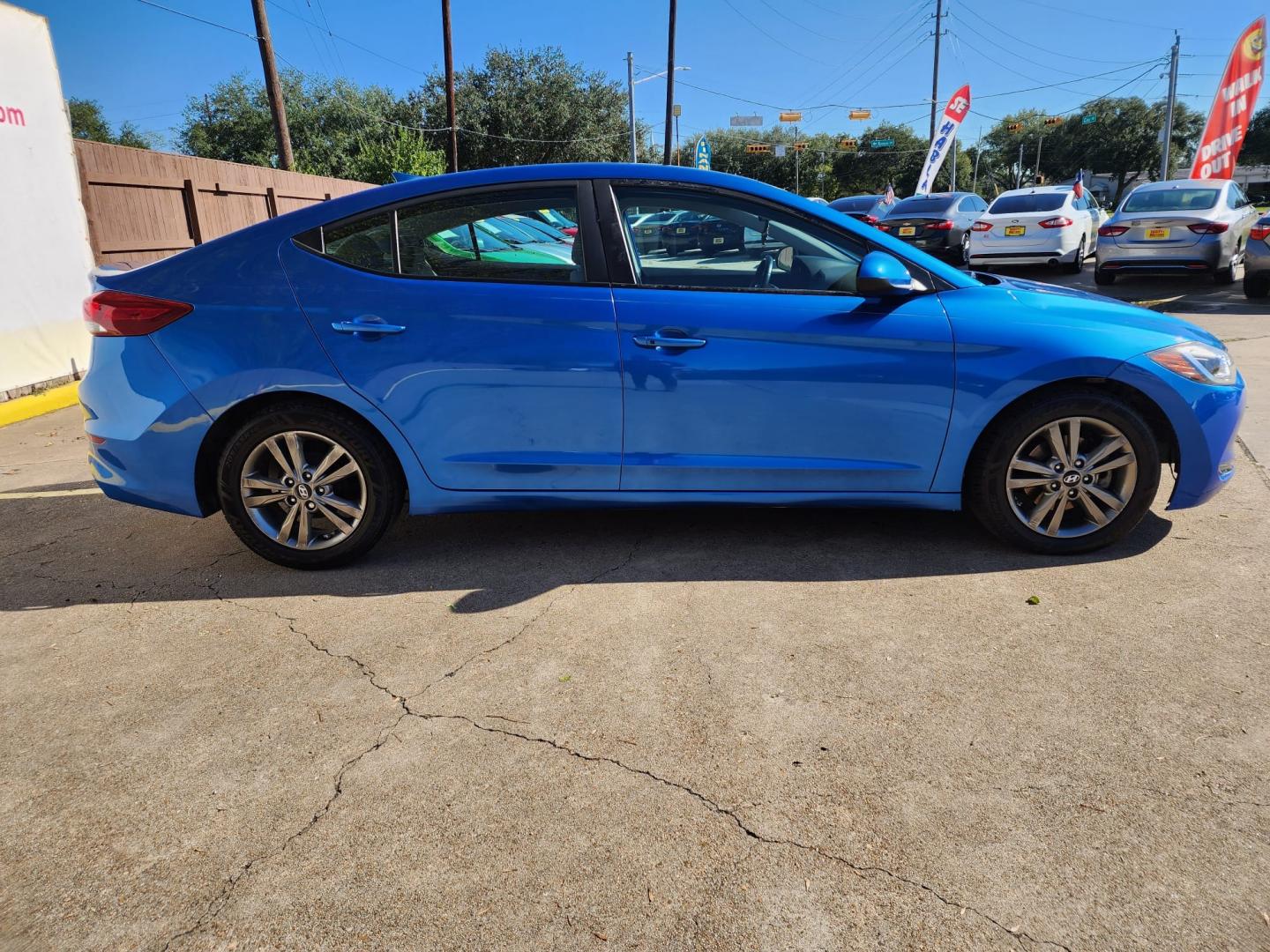 2017 Blue Hyundai Elantra Limited (5NPD84LF2HH) with an 1.8L L4 DOHC 16V engine, 6A transmission, located at 16710 Clay Rd., Houston, TX, 77084, (281) 859-7900, 29.834864, -95.656166 - Photo#4