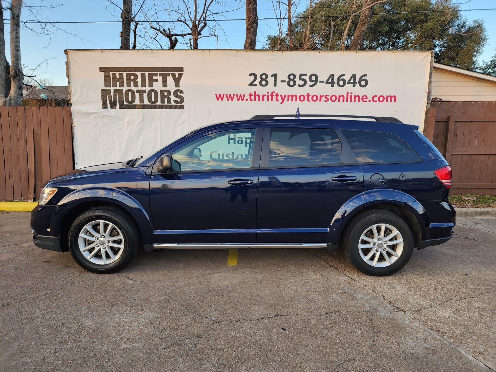 2017 Blue Dodge Journey SE (3C4PDCAB8HT) with an 2.4L L4 DOHC 16V engine, 4A transmission, located at 16710 Clay Rd., Houston, TX, 77084, (281) 859-7900, 29.834864, -95.656166 - Photo #0