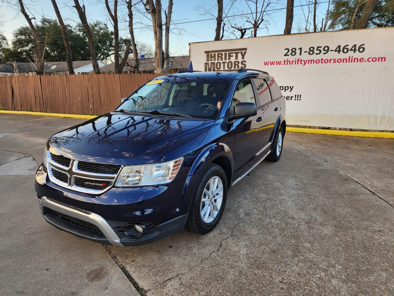 2017 Blue Dodge Journey SE (3C4PDCAB8HT) with an 2.4L L4 DOHC 16V engine, 4A transmission, located at 16710 Clay Rd., Houston, TX, 77084, (281) 859-7900, 29.834864, -95.656166 - Low Down. Low Payments. - Photo #2