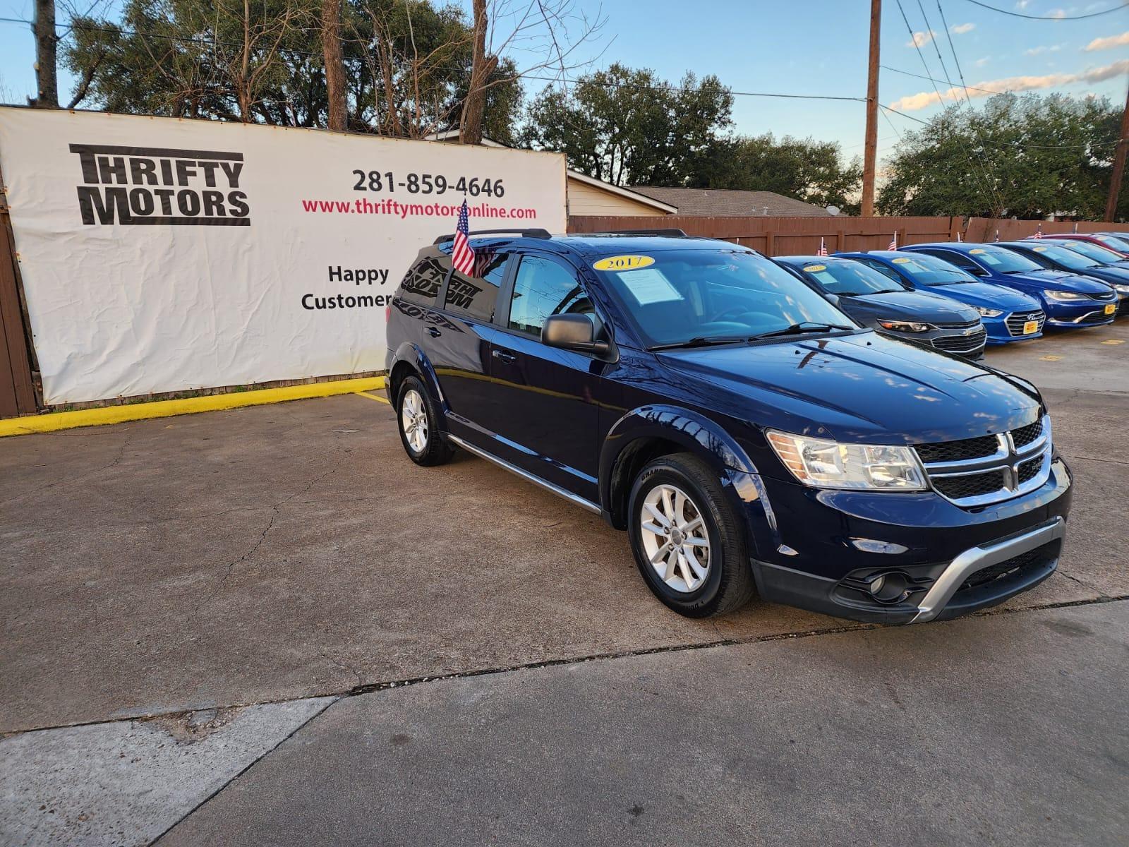 2017 Blue Dodge Journey SE (3C4PDCAB8HT) with an 2.4L L4 DOHC 16V engine, 4A transmission, located at 16710 Clay Rd., Houston, TX, 77084, (281) 859-7900, 29.834864, -95.656166 - Low Down. Low Payments. - Photo #3