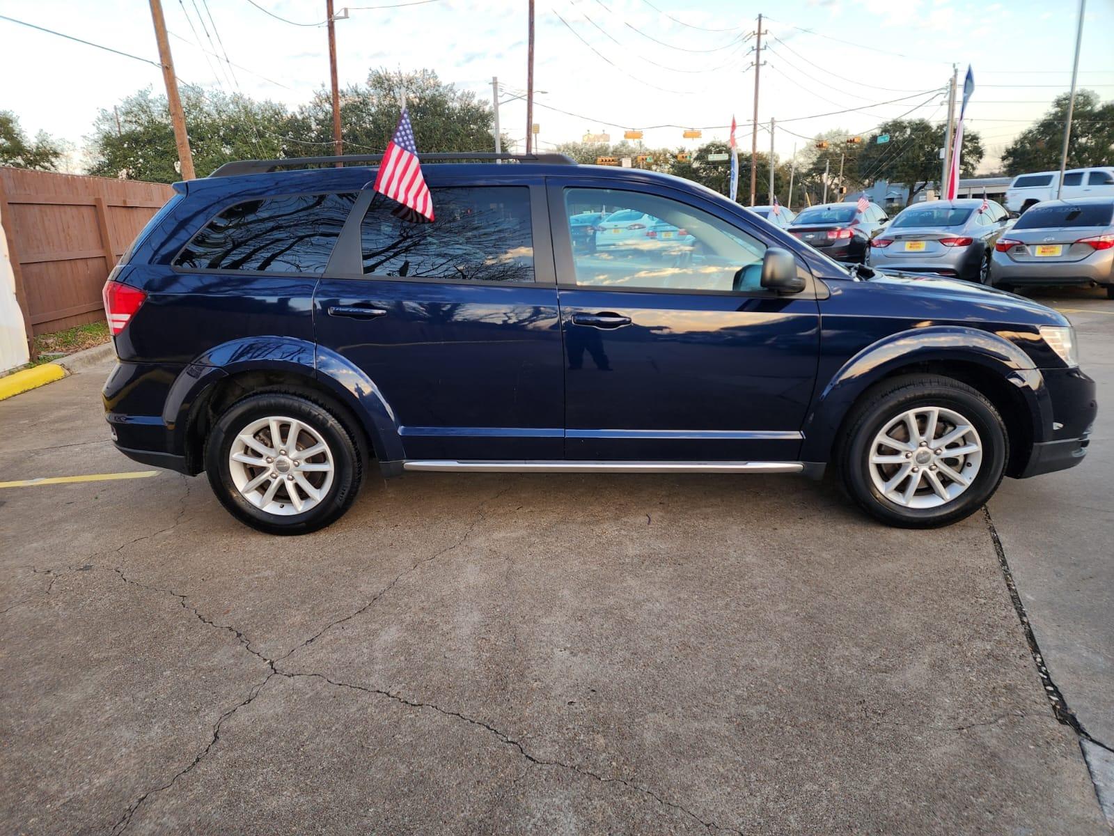 2017 Blue Dodge Journey SE (3C4PDCAB8HT) with an 2.4L L4 DOHC 16V engine, 4A transmission, located at 16710 Clay Rd., Houston, TX, 77084, (281) 859-7900, 29.834864, -95.656166 - Low Down. Low Payments. - Photo #4