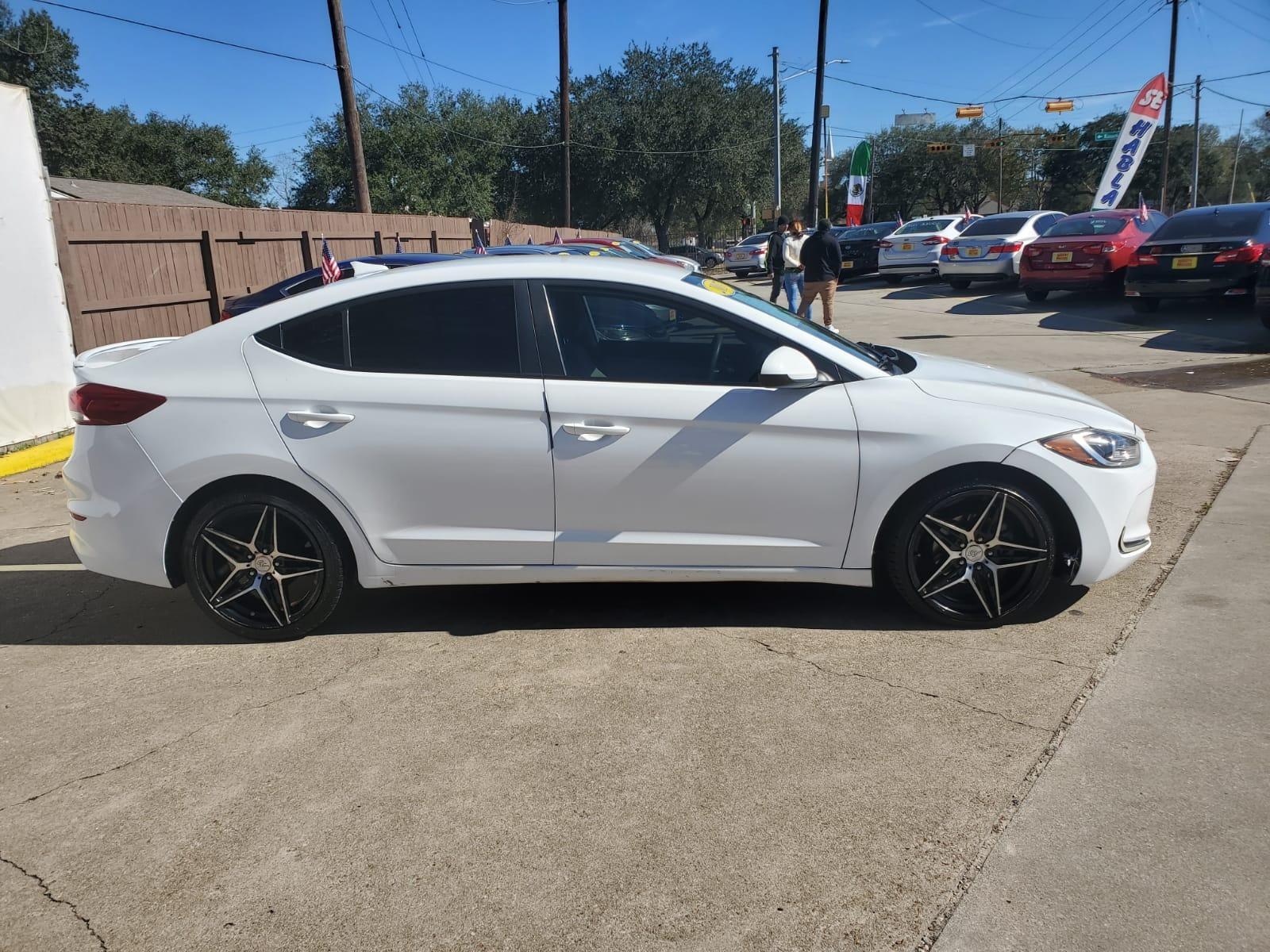 2017 White Hyundai Elantra SE 6AT (5NPD74LF0HH) with an 1.8L L4 DOHC 16V engine, 6A transmission, located at 16710 Clay Rd., Houston, TX, 77084, (281) 859-7900, 29.834864, -95.656166 - Low Down. Low Payments. - Photo #5