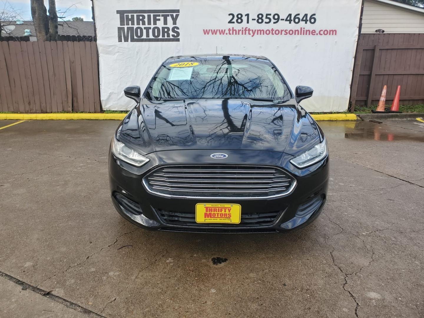 2018 Black Ford Fusion SE (3FA6P0HD6JR) with an 1.5L L4 DOHC 16V engine, 6A transmission, located at 16710 Clay Rd., Houston, TX, 77084, (281) 859-7900, 29.834864, -95.656166 - Low Down. Low Payments. - Photo#1