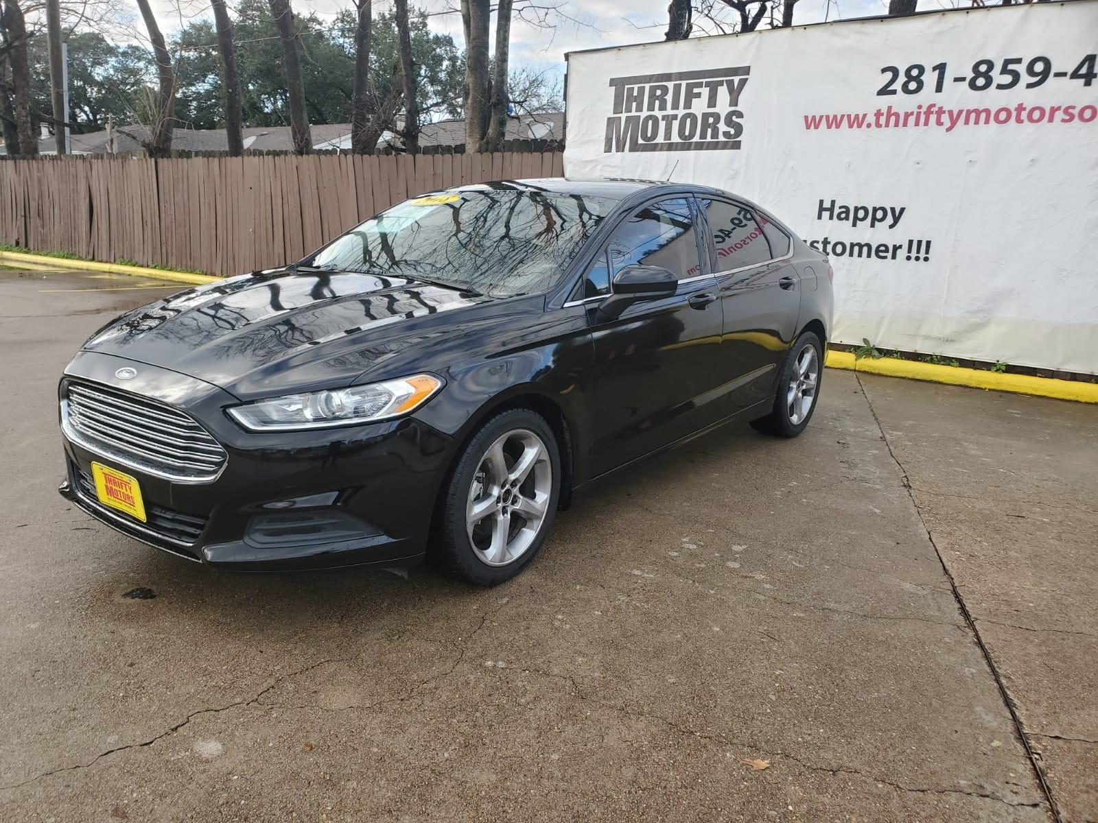 2018 Black Ford Fusion SE (3FA6P0HD6JR) with an 1.5L L4 DOHC 16V engine, 6A transmission, located at 16710 Clay Rd., Houston, TX, 77084, (281) 859-7900, 29.834864, -95.656166 - Low Down. Low Payments. - Photo #2