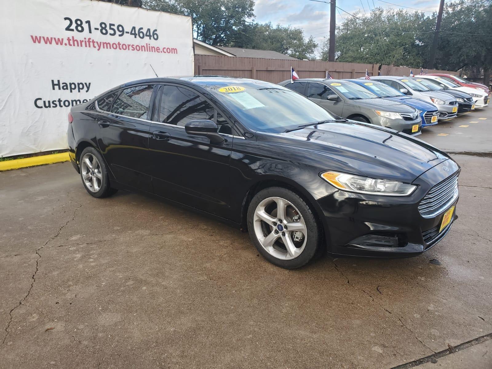 2018 Black Ford Fusion SE (3FA6P0HD6JR) with an 1.5L L4 DOHC 16V engine, 6A transmission, located at 16710 Clay Rd., Houston, TX, 77084, (281) 859-7900, 29.834864, -95.656166 - Low Down. Low Payments. - Photo #3
