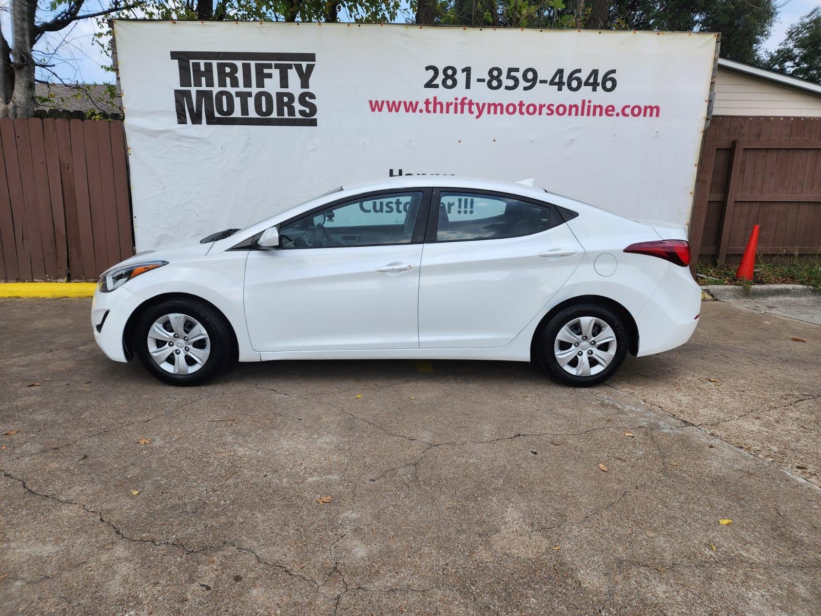 2016 White Hyundai Elantra (5NPDH4AE1GH) with an 1.8L I4 1.8L I4 engine, Automatic 6-Speed transmission, located at 16710 Clay Rd., Houston, TX, 77084, (281) 859-7900, 29.834864, -95.656166 - Low Down. Low payments - Photo #0