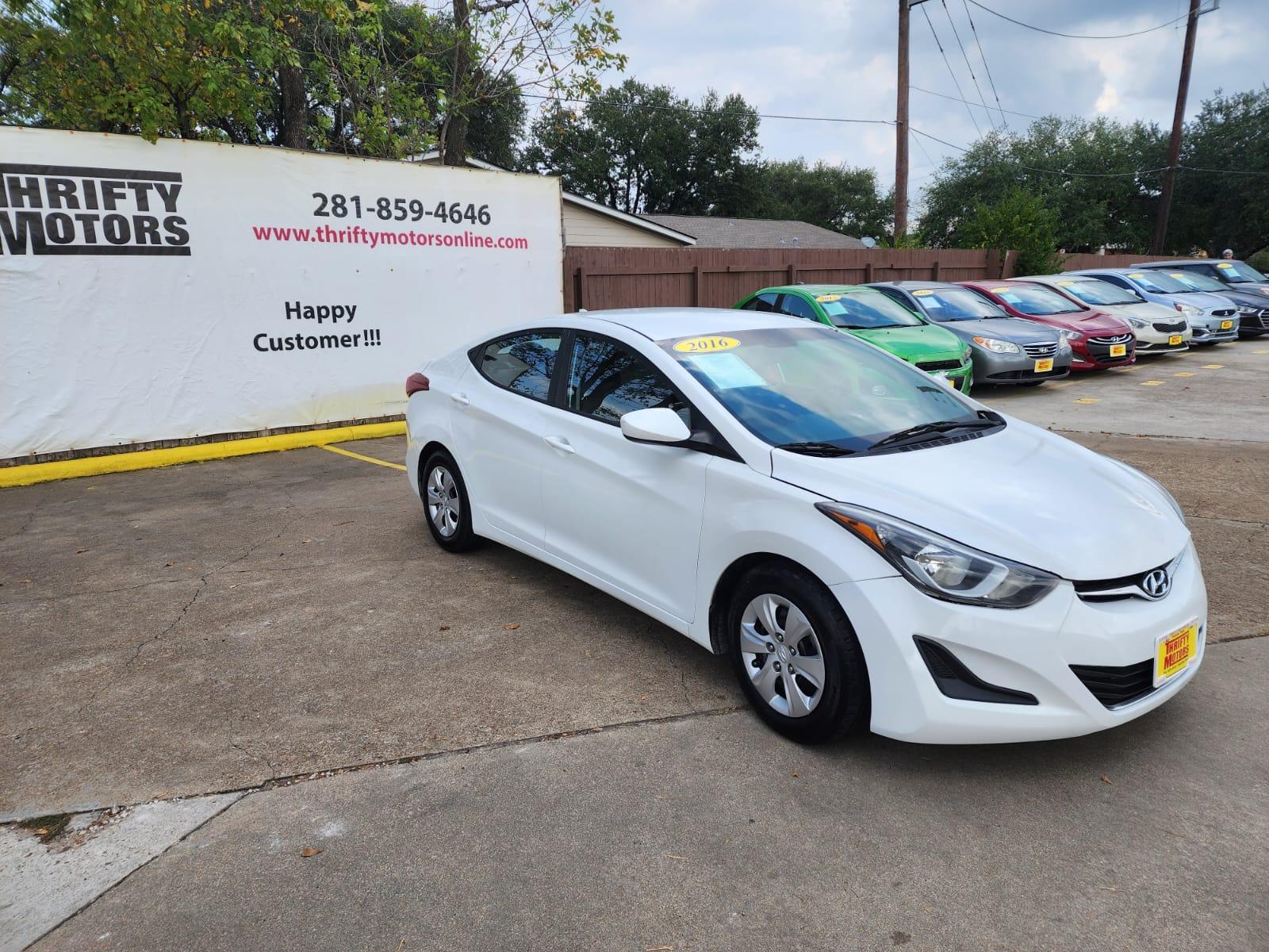 2016 White Hyundai Elantra (5NPDH4AE1GH) with an 1.8L I4 1.8L I4 engine, Automatic 6-Speed transmission, located at 16710 Clay Rd., Houston, TX, 77084, (281) 859-7900, 29.834864, -95.656166 - Low Down. Low payments - Photo #3