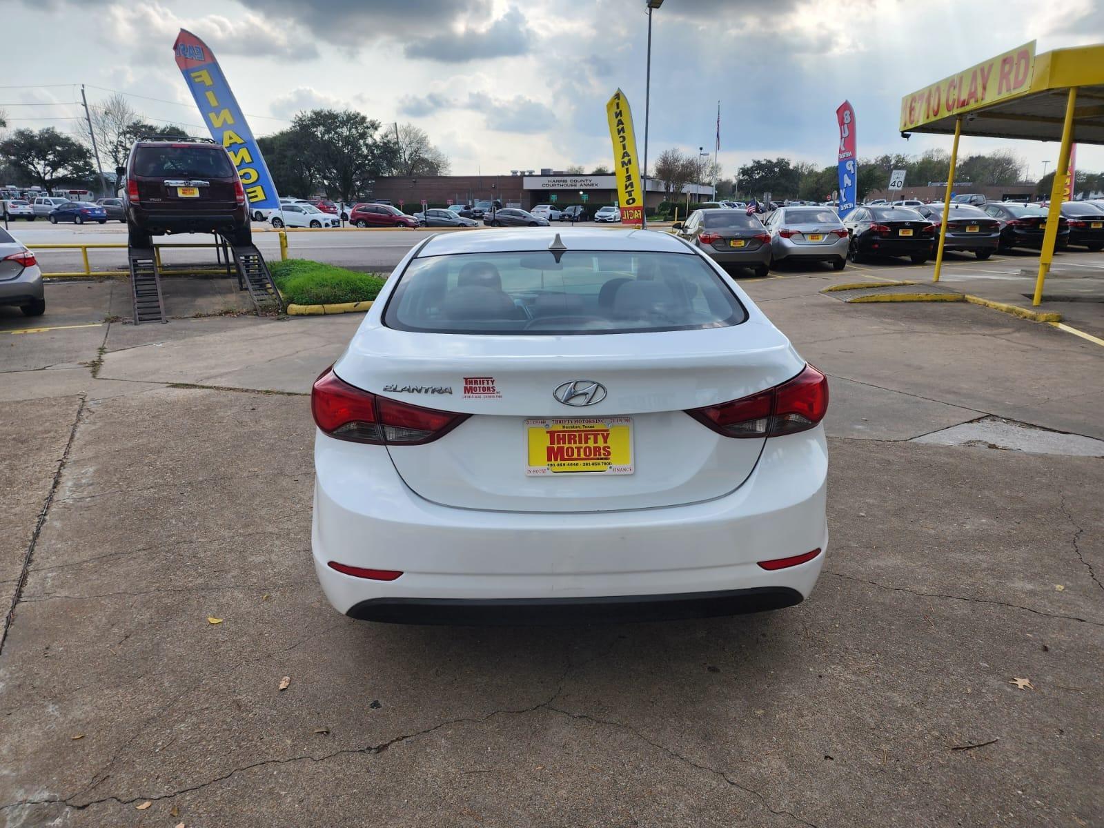 2016 White Hyundai Elantra (5NPDH4AE1GH) with an 1.8L I4 1.8L I4 engine, Automatic 6-Speed transmission, located at 16710 Clay Rd., Houston, TX, 77084, (281) 859-7900, 29.834864, -95.656166 - Low Down. Low payments - Photo #5
