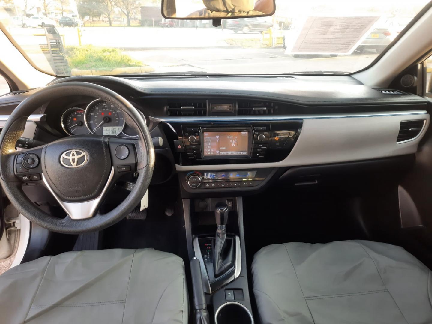 2015 White /Gray Toyota Corolla L 4-Speed AT (2T1BURHE2FC) with an 1.8L L4 DOHC 16V engine, Automatic 4-Speed transmission, located at 16710 Clay Rd., Houston, TX, 77084, (281) 859-7900, 29.834864, -95.656166 - Low Down. Low Payments. - Photo#2