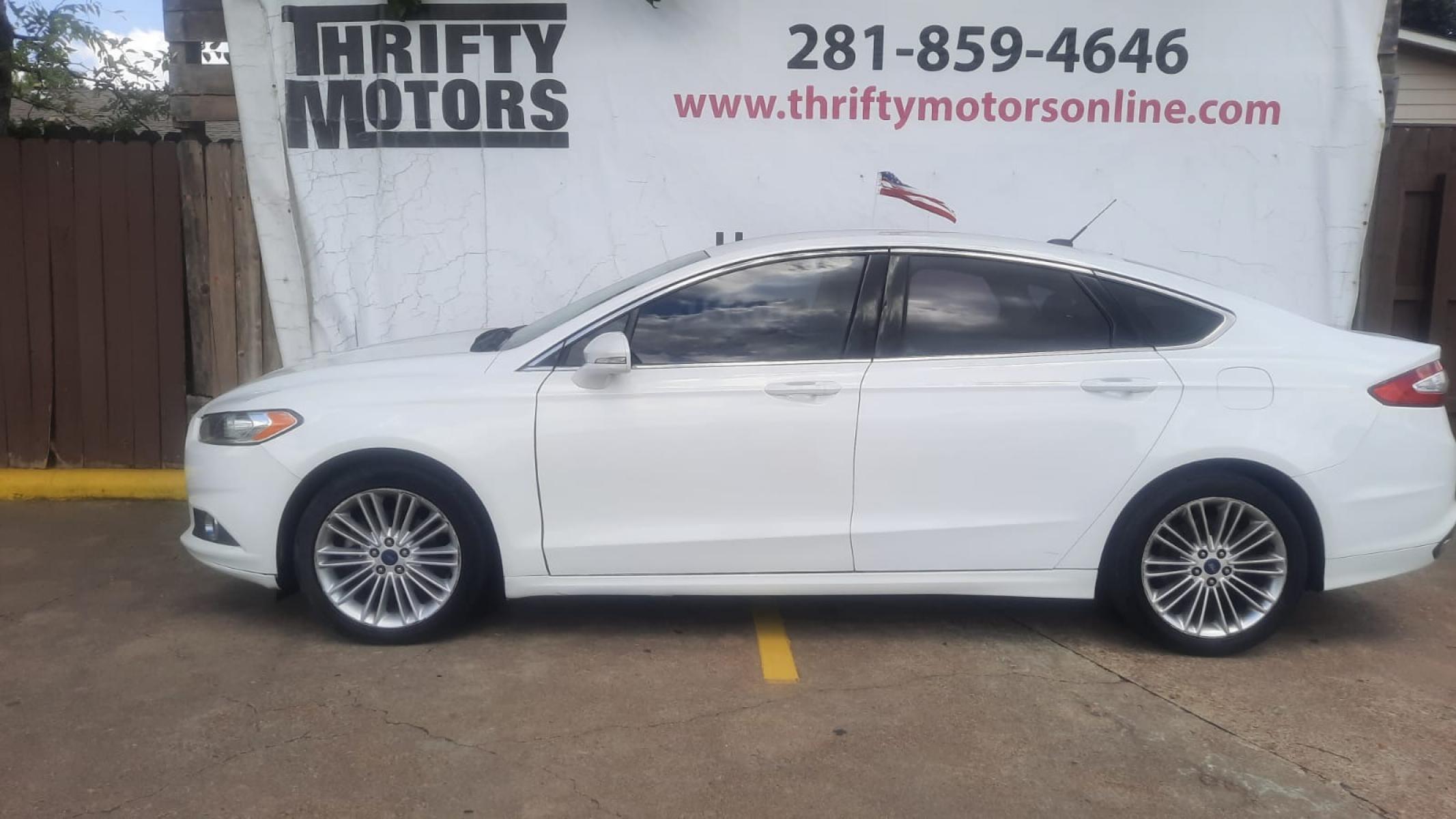 2014 Ford Fusion SE (3FA6P0H90ER) with an 2.0L L4 DOHC 16V engine, located at 16710 Clay Rd., Houston, TX, 77084, (281) 859-7900, 29.834864, -95.656166 - Photo #9