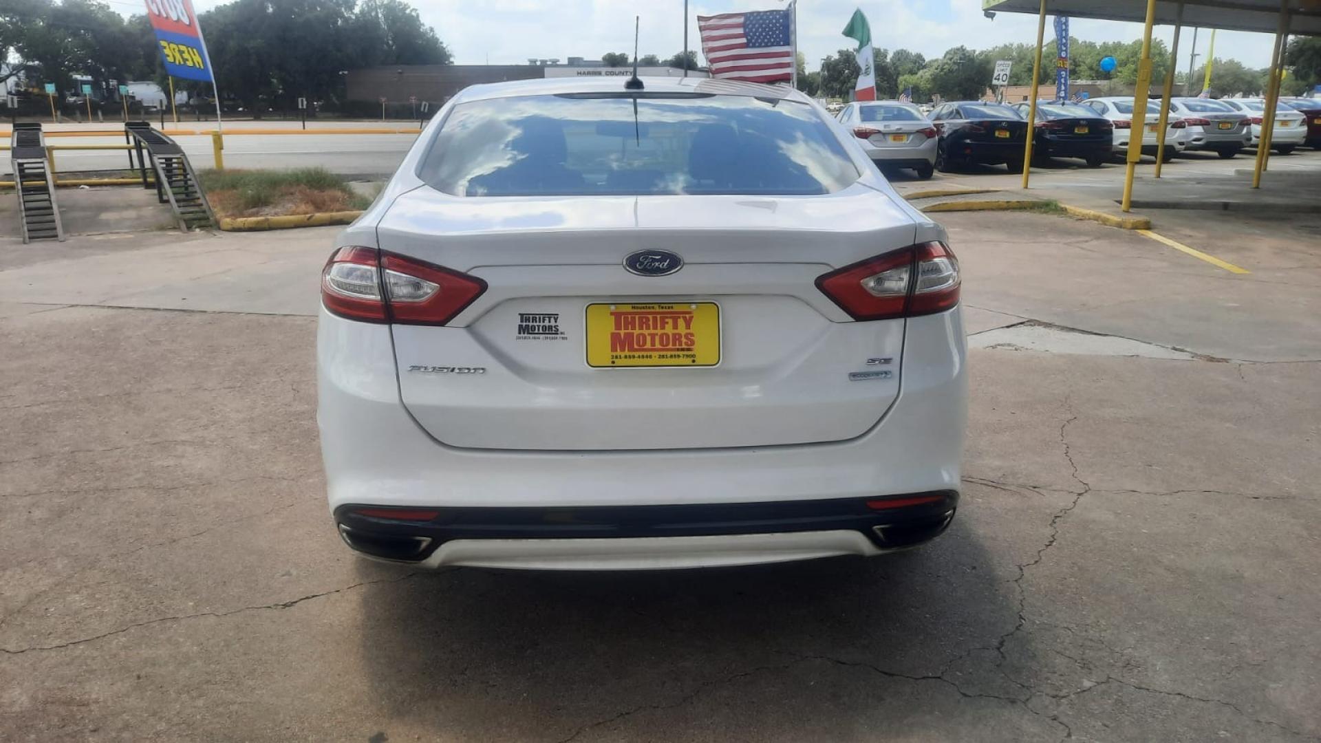 2014 Ford Fusion SE (3FA6P0H90ER) with an 2.0L L4 DOHC 16V engine, located at 16710 Clay Rd., Houston, TX, 77084, (281) 859-7900, 29.834864, -95.656166 - Photo#4