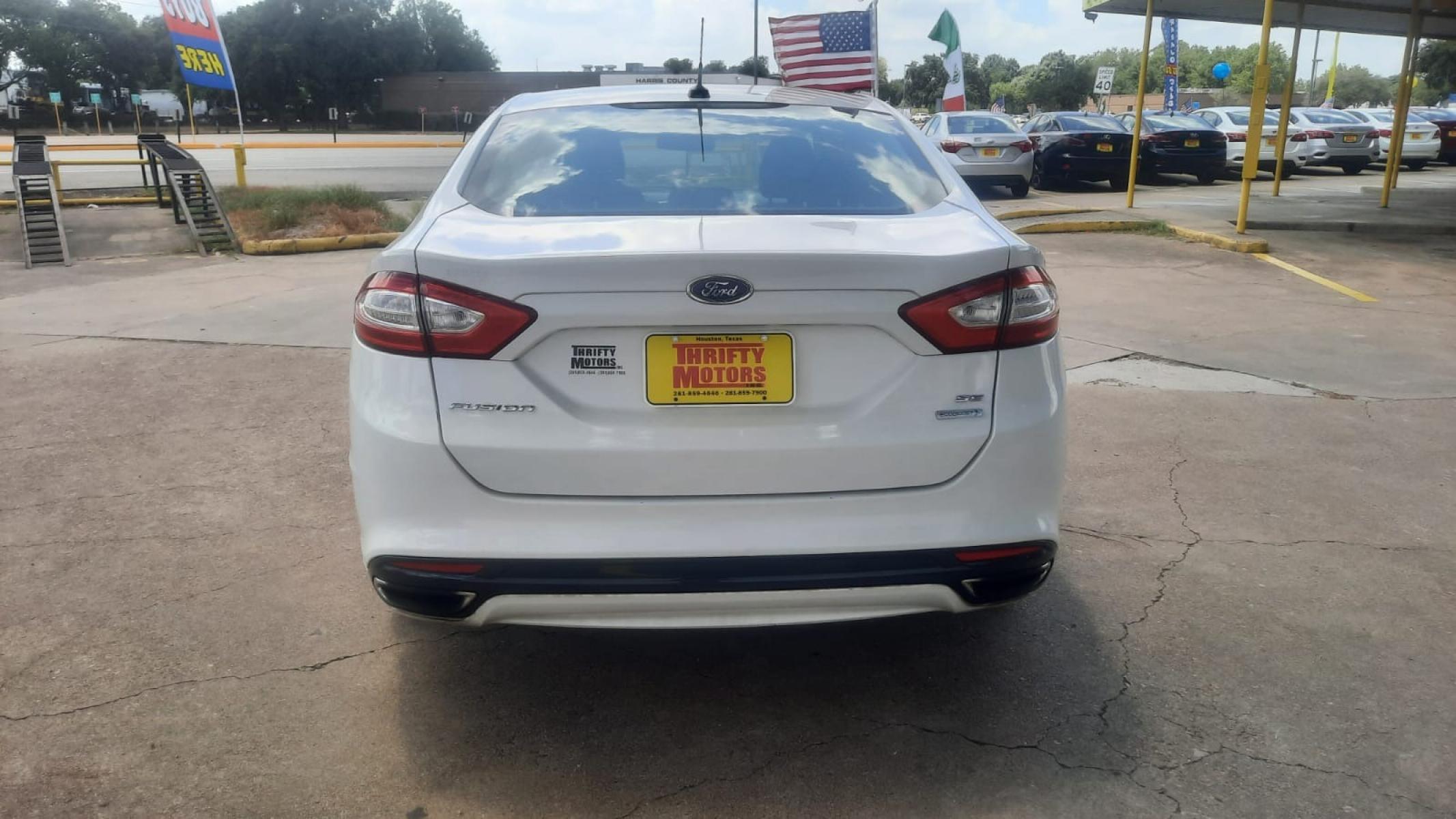 2014 Ford Fusion SE (3FA6P0H90ER) with an 2.0L L4 DOHC 16V engine, located at 16710 Clay Rd., Houston, TX, 77084, (281) 859-7900, 29.834864, -95.656166 - Photo #4
