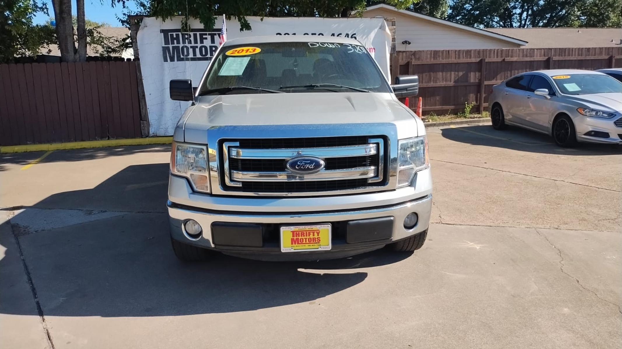 2013 Ford F-150 FX2 SuperCrew 5.5-ft. Bed 2WD (1FTFW1CF7DF) with an 5.0L V8 engine, 6-Speed Automatic transmission, located at 16710 Clay Rd., Houston, TX, 77084, (281) 859-7900, 29.834864, -95.656166 - Photo #7