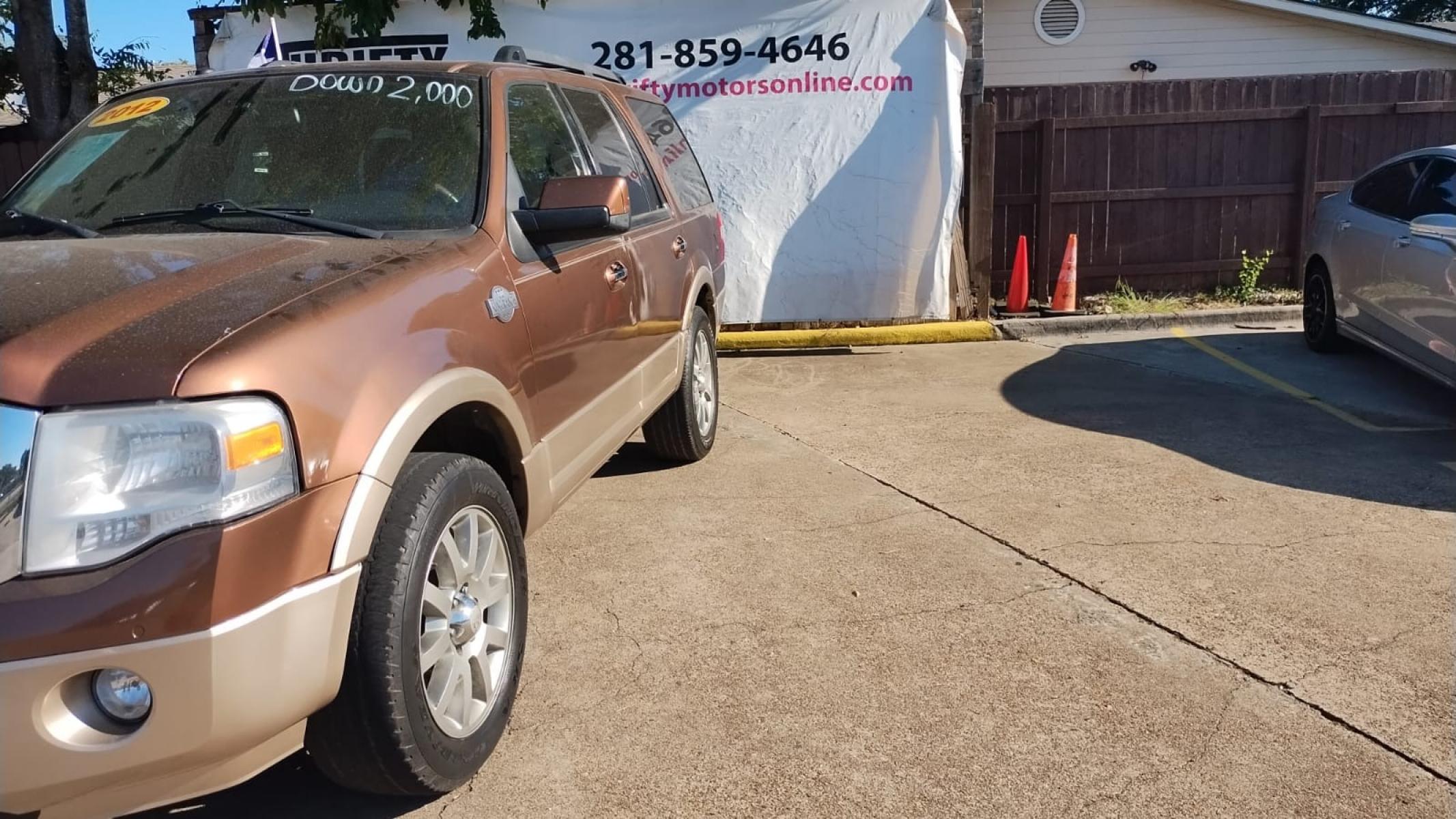2012 Ford Expedition King Ranch 2WD (1FMJU1H57CE) with an 5.4L V8 SOHC 16V FFV engine, 6-Speed Automatic transmission, located at 16710 Clay Rd., Houston, TX, 77084, (281) 859-7900, 29.834864, -95.656166 - Photo #5