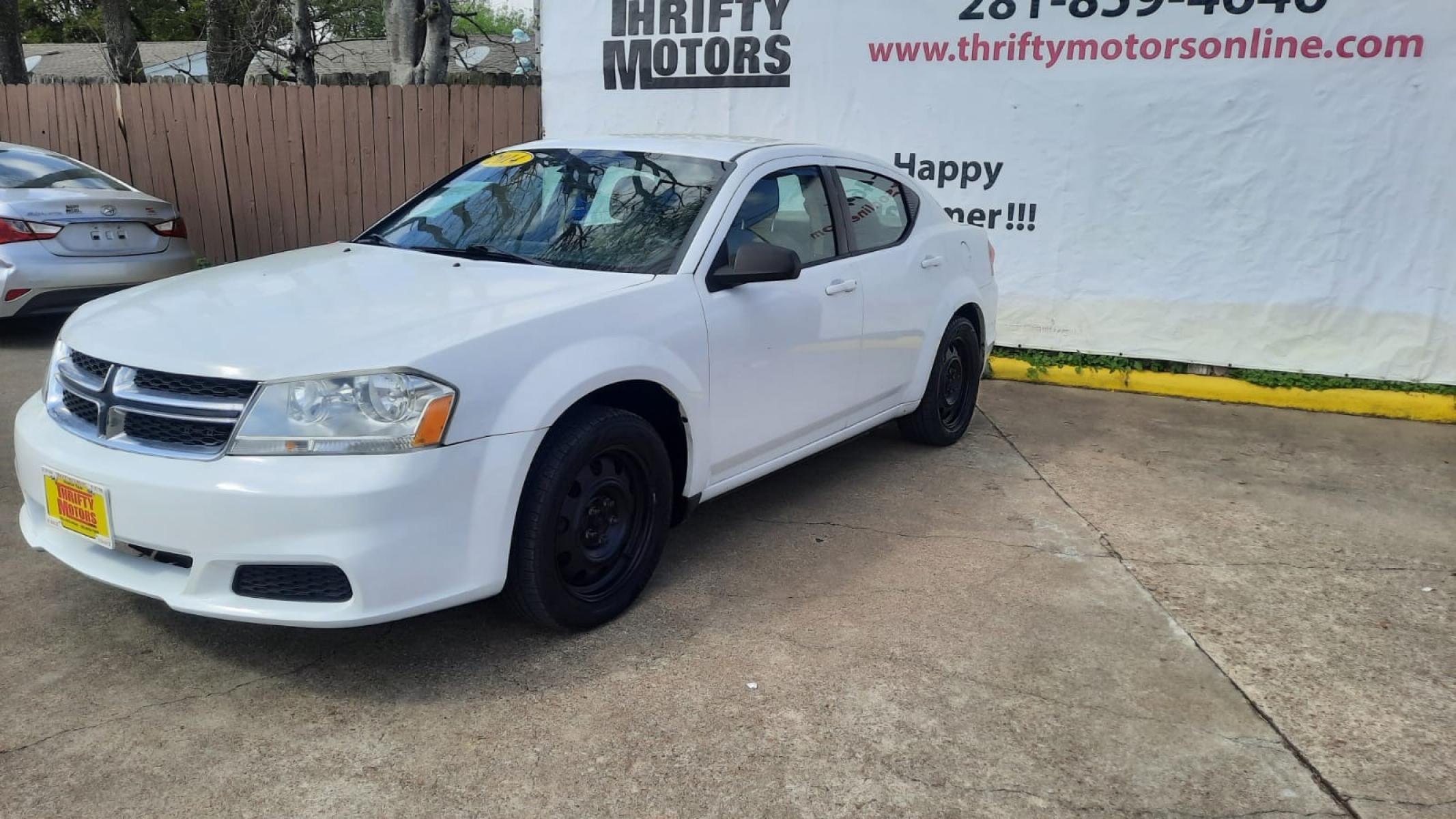 2014 White Dodge Avenger (1C3CDZAG9EN) with an 3.6L V6 3.6L V6 engine, Automatic 6-Speed transmission, located at 16710 Clay Rd., Houston, TX, 77084, (281) 859-7900, 29.834864, -95.656166 - Low Down. Low Payments. - Photo #2