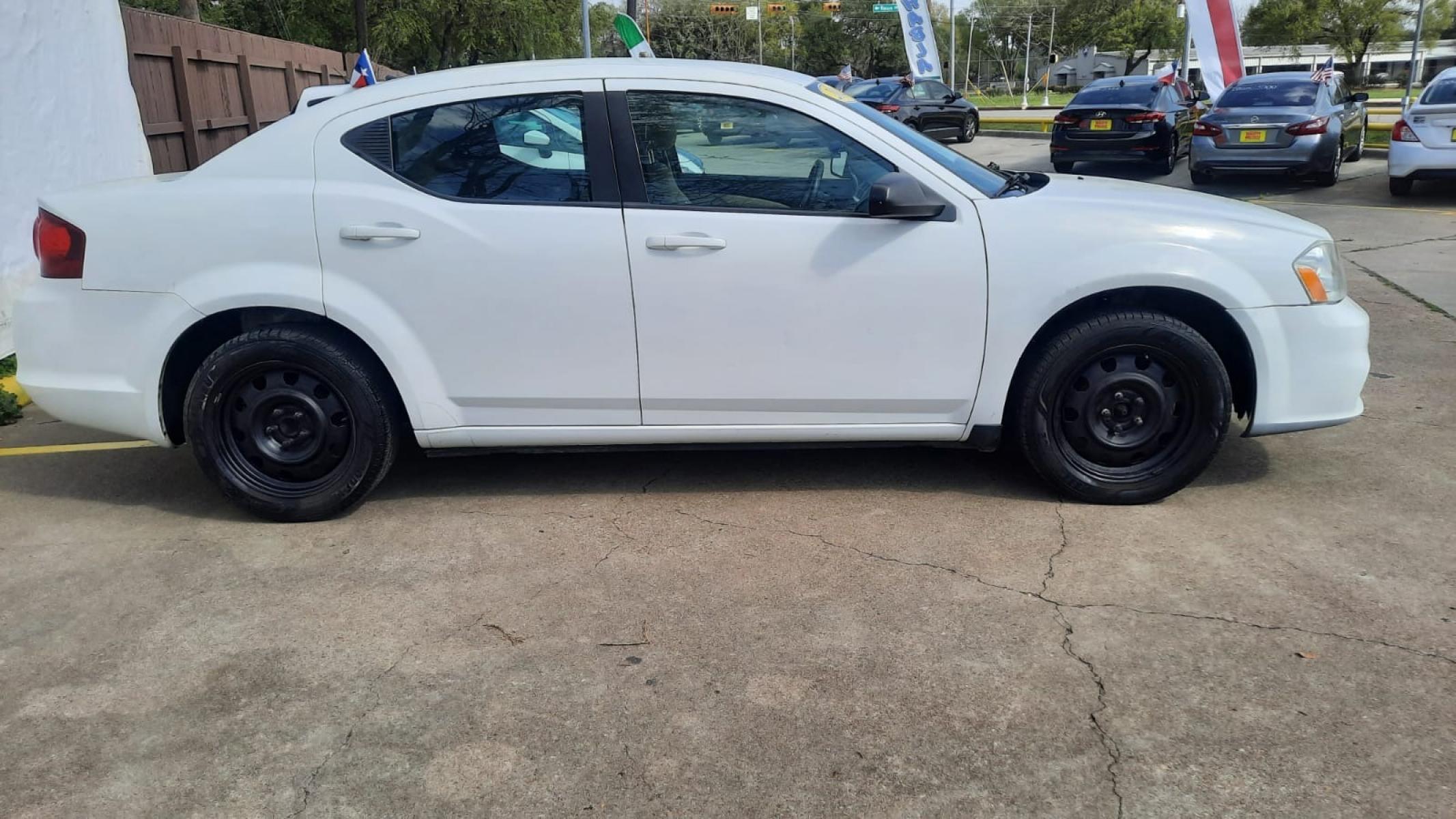 2014 White Dodge Avenger (1C3CDZAG9EN) with an 3.6L V6 3.6L V6 engine, Automatic 6-Speed transmission, located at 16710 Clay Rd., Houston, TX, 77084, (281) 859-7900, 29.834864, -95.656166 - Low Down. Low Payments. - Photo #3