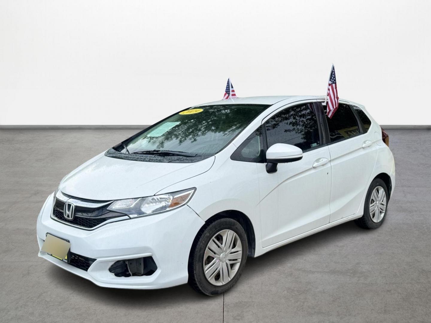 2019 White /Gray Honda Fit LX CVT (3HGGK5H47KM) with an 1.5L L4 SOHC 16V engine, Automatic transmission, located at 16710 Clay Rd., Houston, TX, 77084, (281) 859-7900, 29.834864, -95.656166 - Photo#0