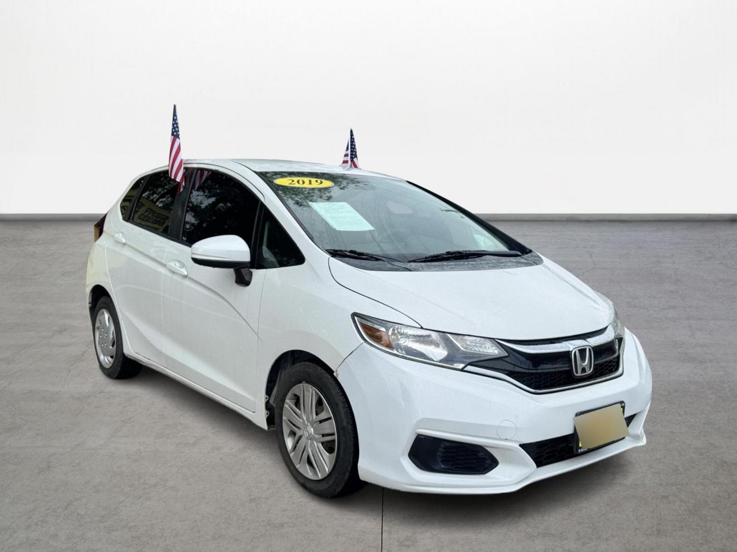 2019 White /Gray Honda Fit LX CVT (3HGGK5H47KM) with an 1.5L L4 SOHC 16V engine, Automatic transmission, located at 16710 Clay Rd., Houston, TX, 77084, (281) 859-7900, 29.834864, -95.656166 - Photo#2