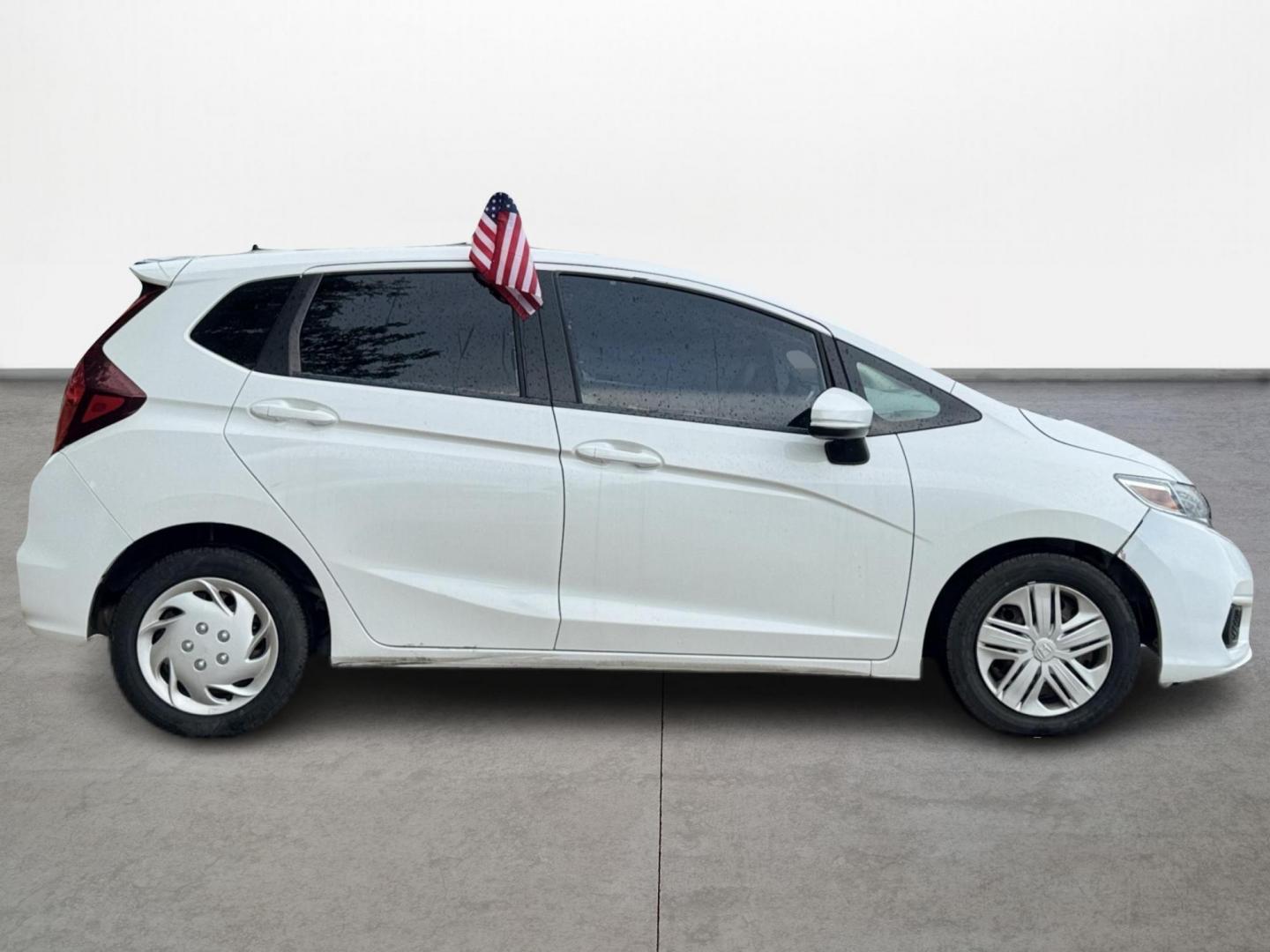 2019 White /Gray Honda Fit LX CVT (3HGGK5H47KM) with an 1.5L L4 SOHC 16V engine, Automatic transmission, located at 16710 Clay Rd., Houston, TX, 77084, (281) 859-7900, 29.834864, -95.656166 - Photo#3
