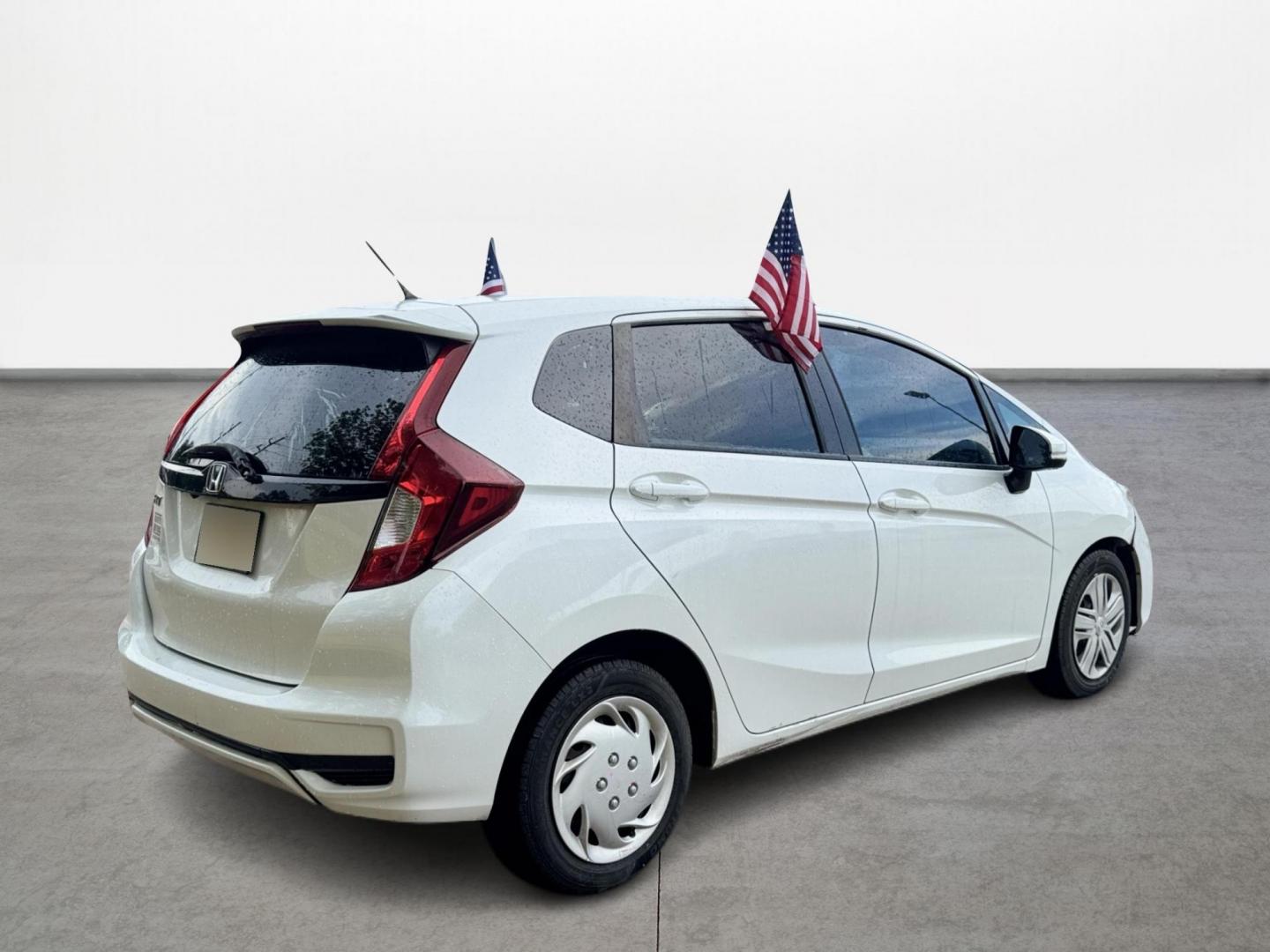 2019 White /Gray Honda Fit LX CVT (3HGGK5H47KM) with an 1.5L L4 SOHC 16V engine, Automatic transmission, located at 16710 Clay Rd., Houston, TX, 77084, (281) 859-7900, 29.834864, -95.656166 - Photo#4